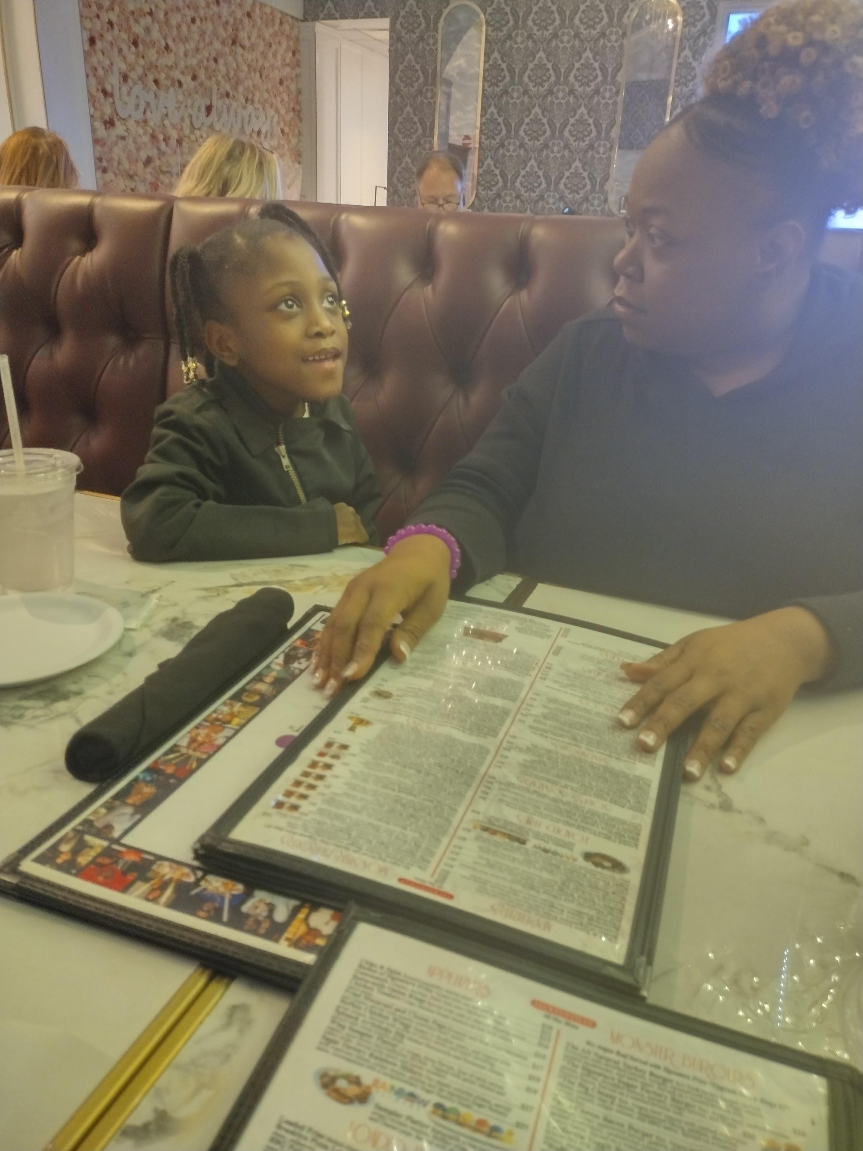 A woman and a child sitting at a table