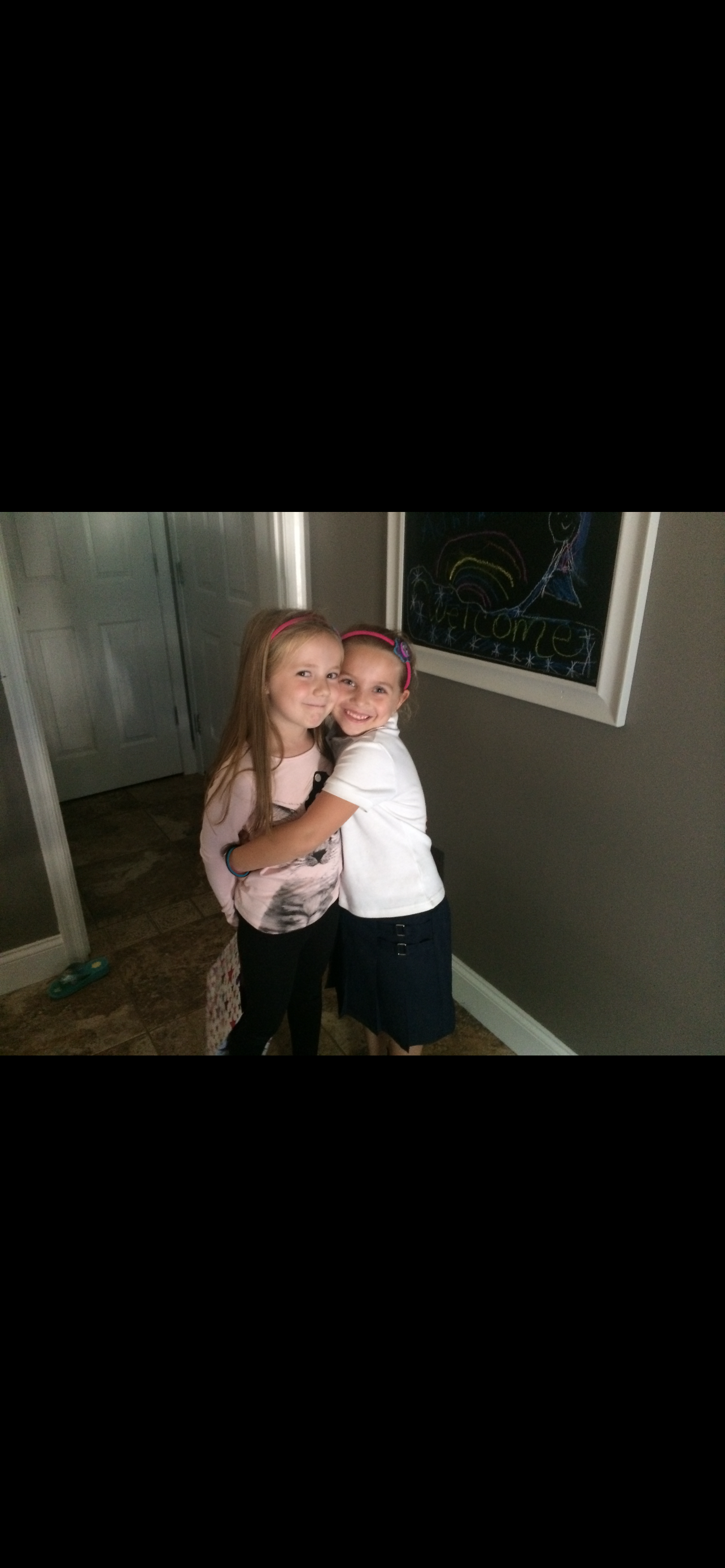 Two girls hugging each other