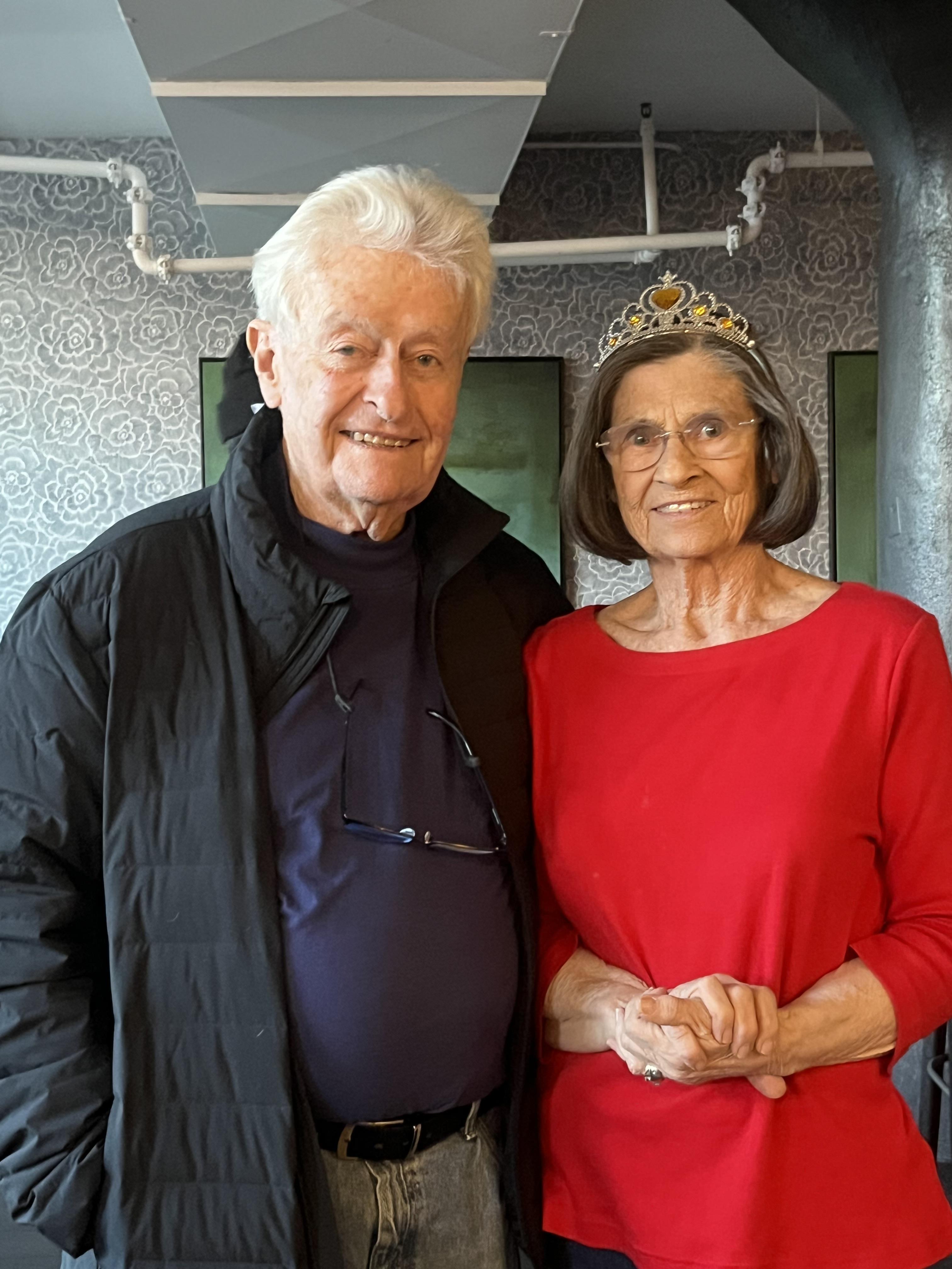 A man and woman posing for a picture