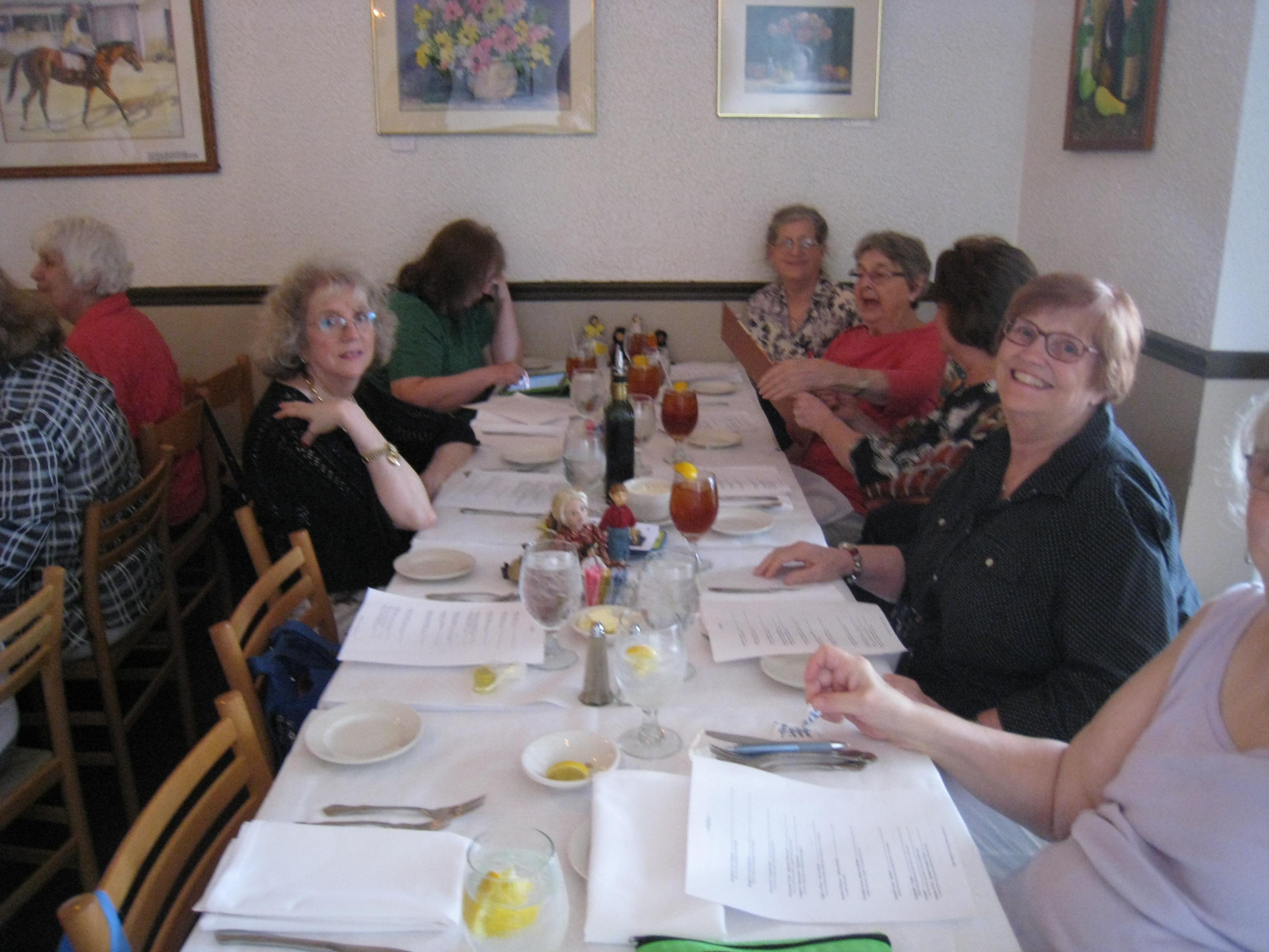 A group of women sitting at a long table