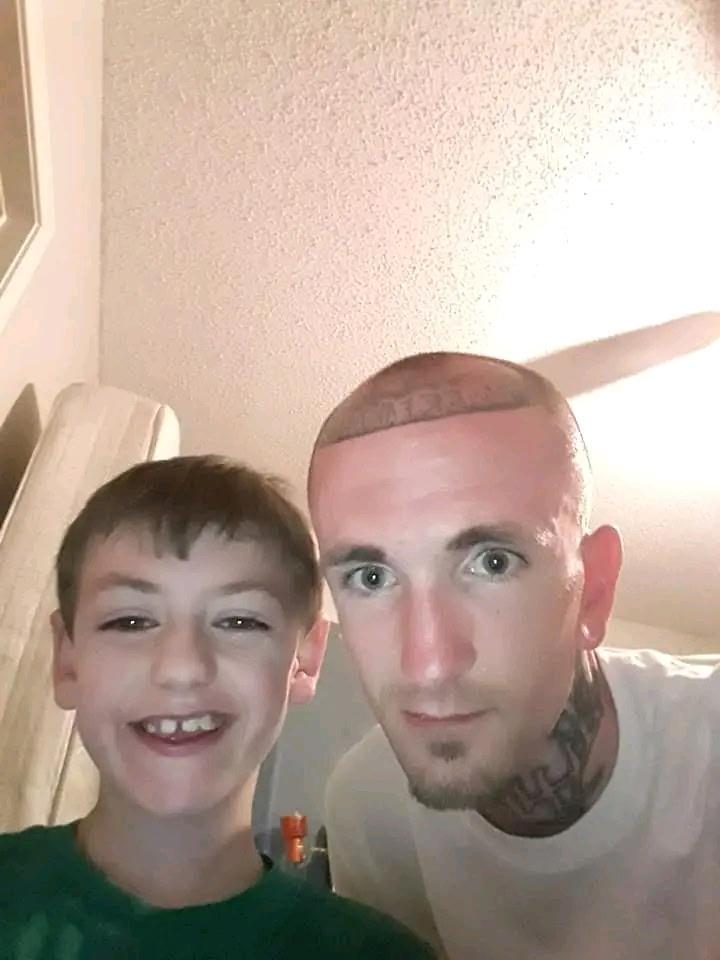 A man and boy taking a selfie