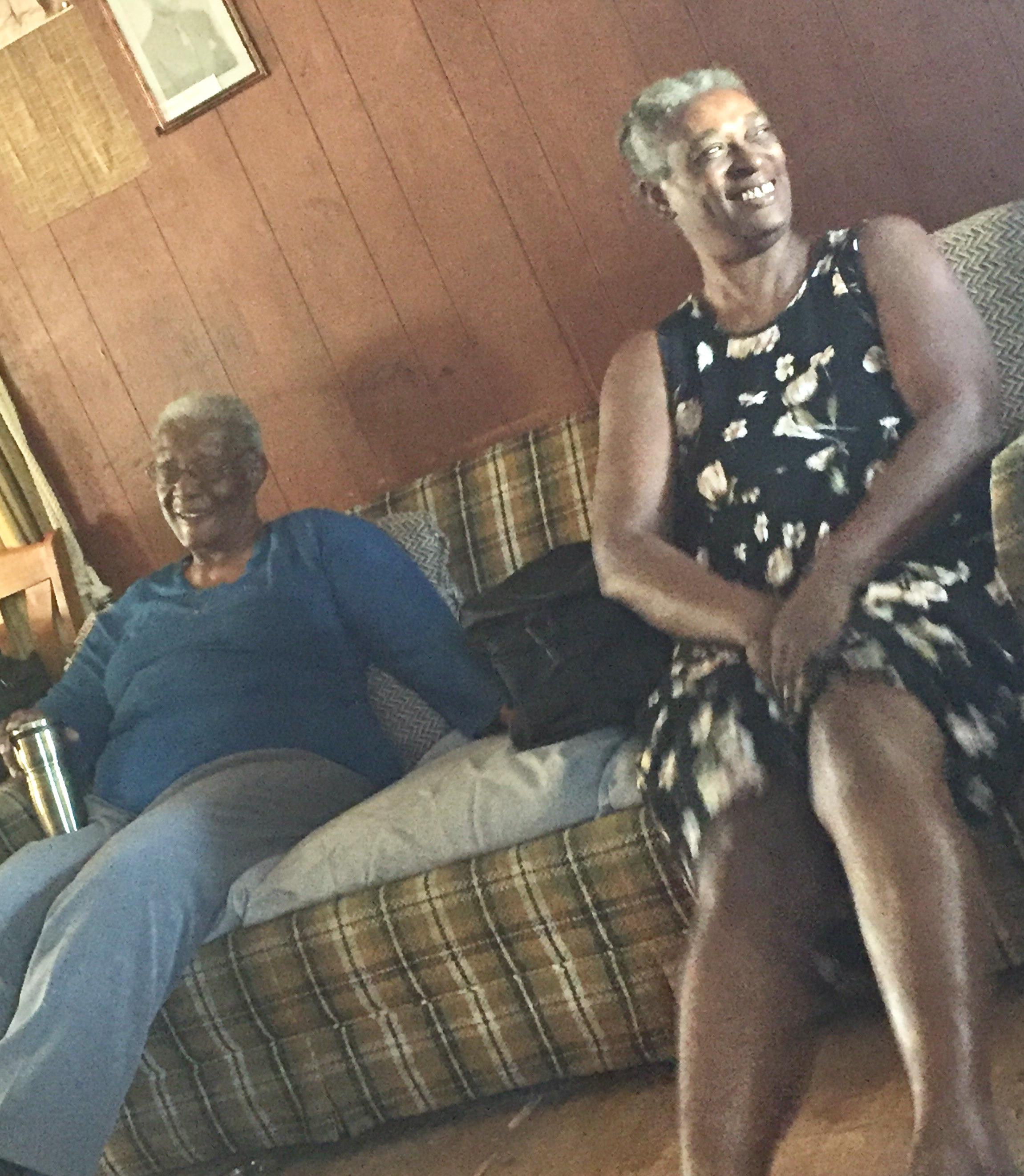 Two women sitting on a couch