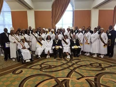 A group of people wearing white robes