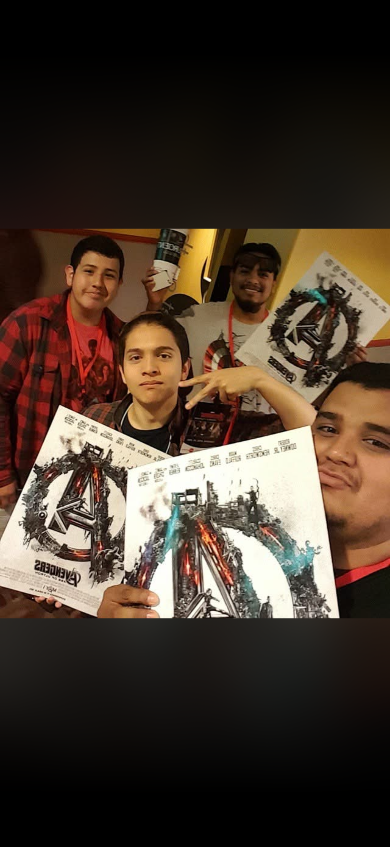 A group of men holding up posters