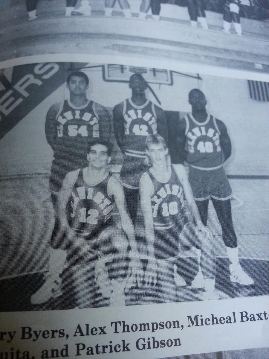 A group of men in basketball uniforms