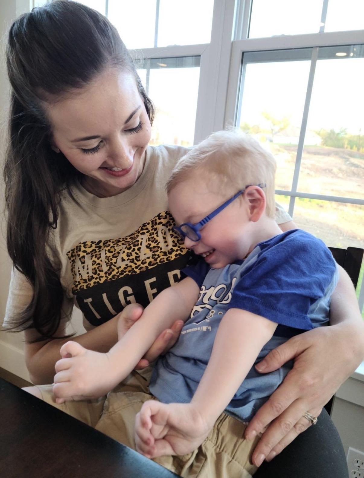 A woman holding a baby