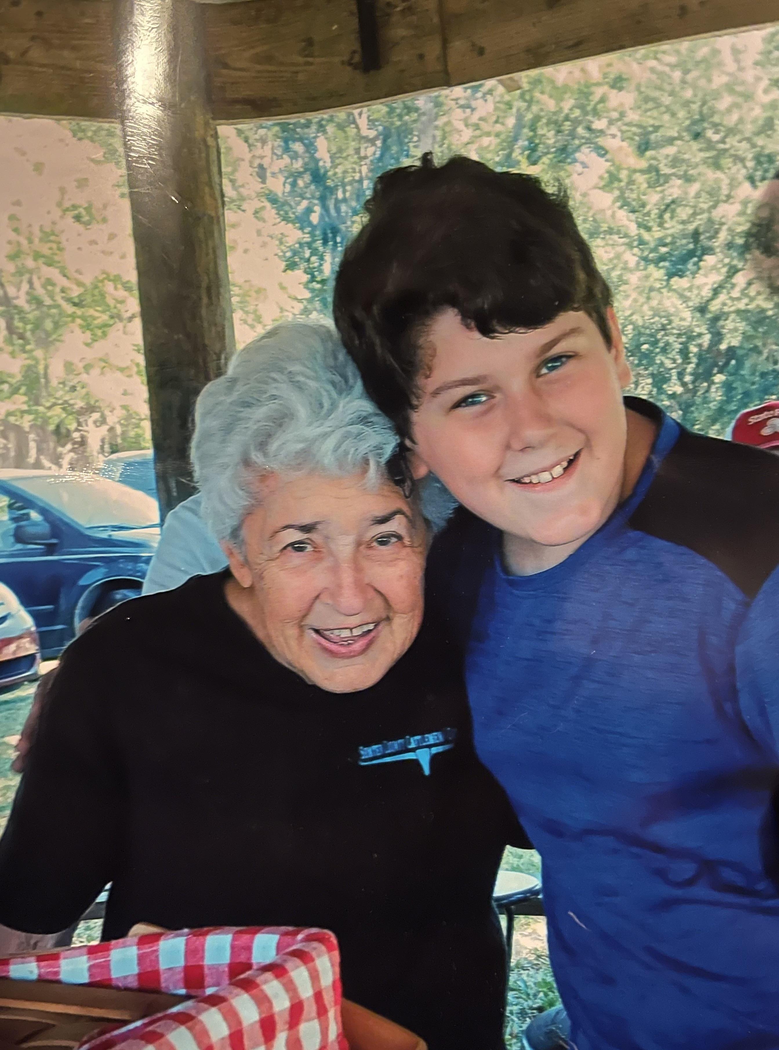 A woman and boy posing for a picture