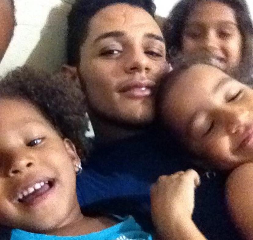 A man and children taking a selfie