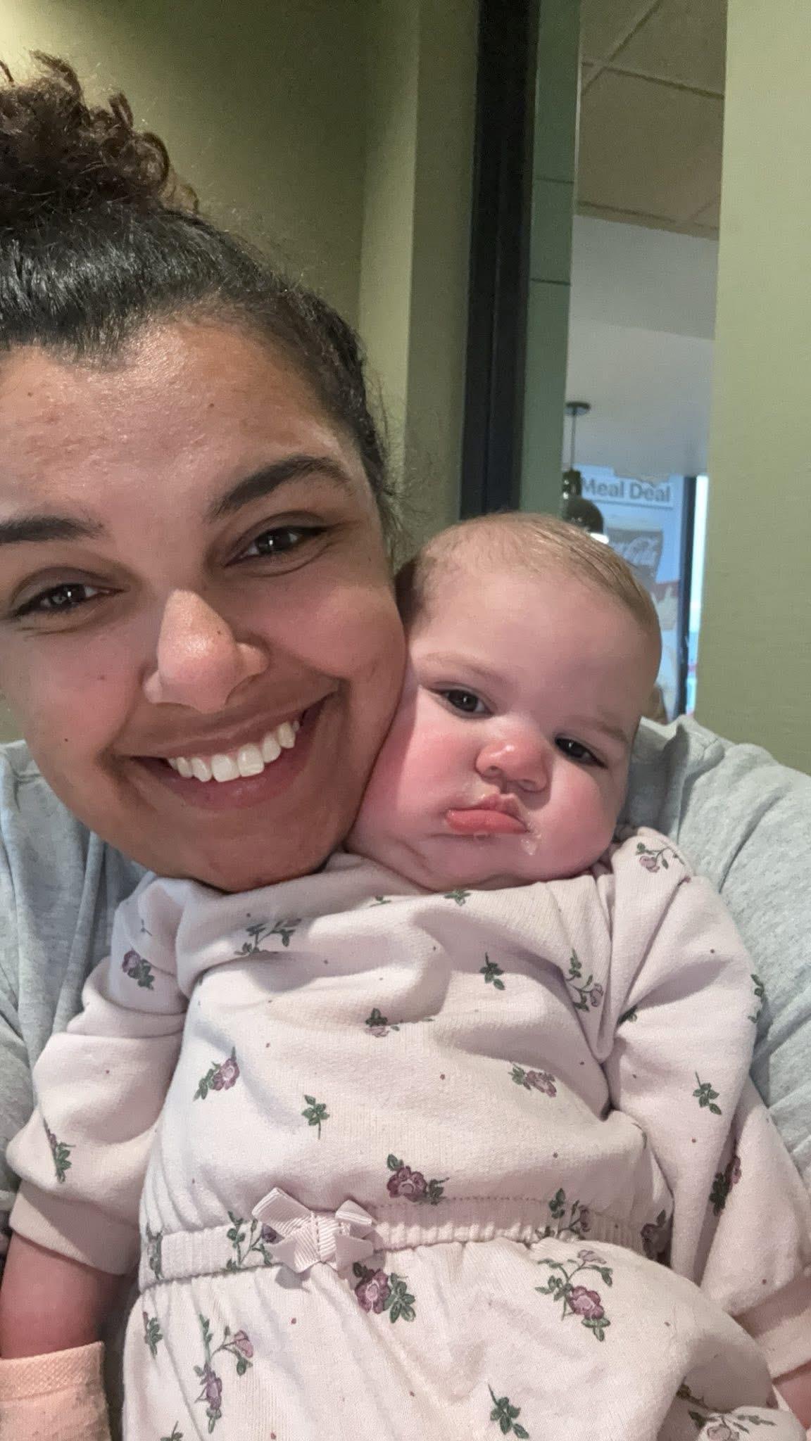 A woman holding a baby