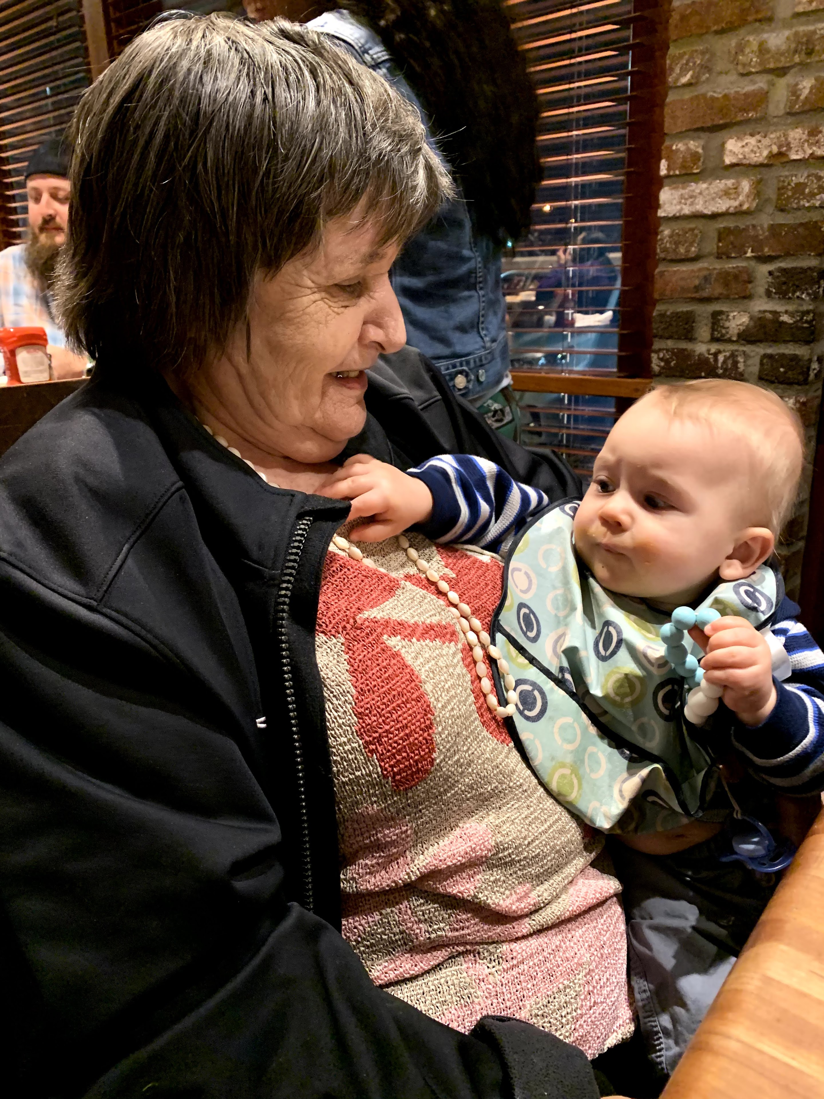 A woman holding a baby