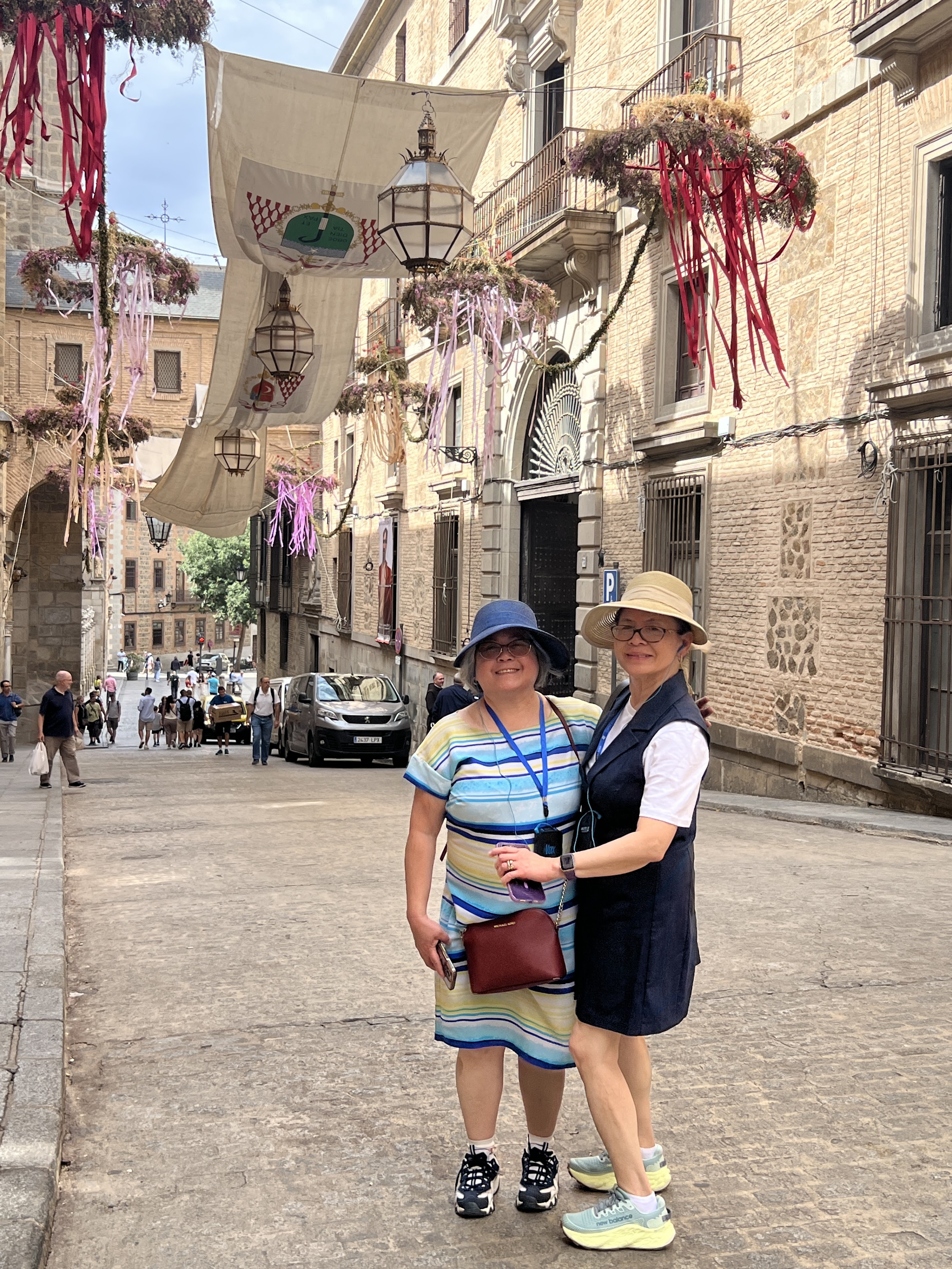 Two women standing in a street