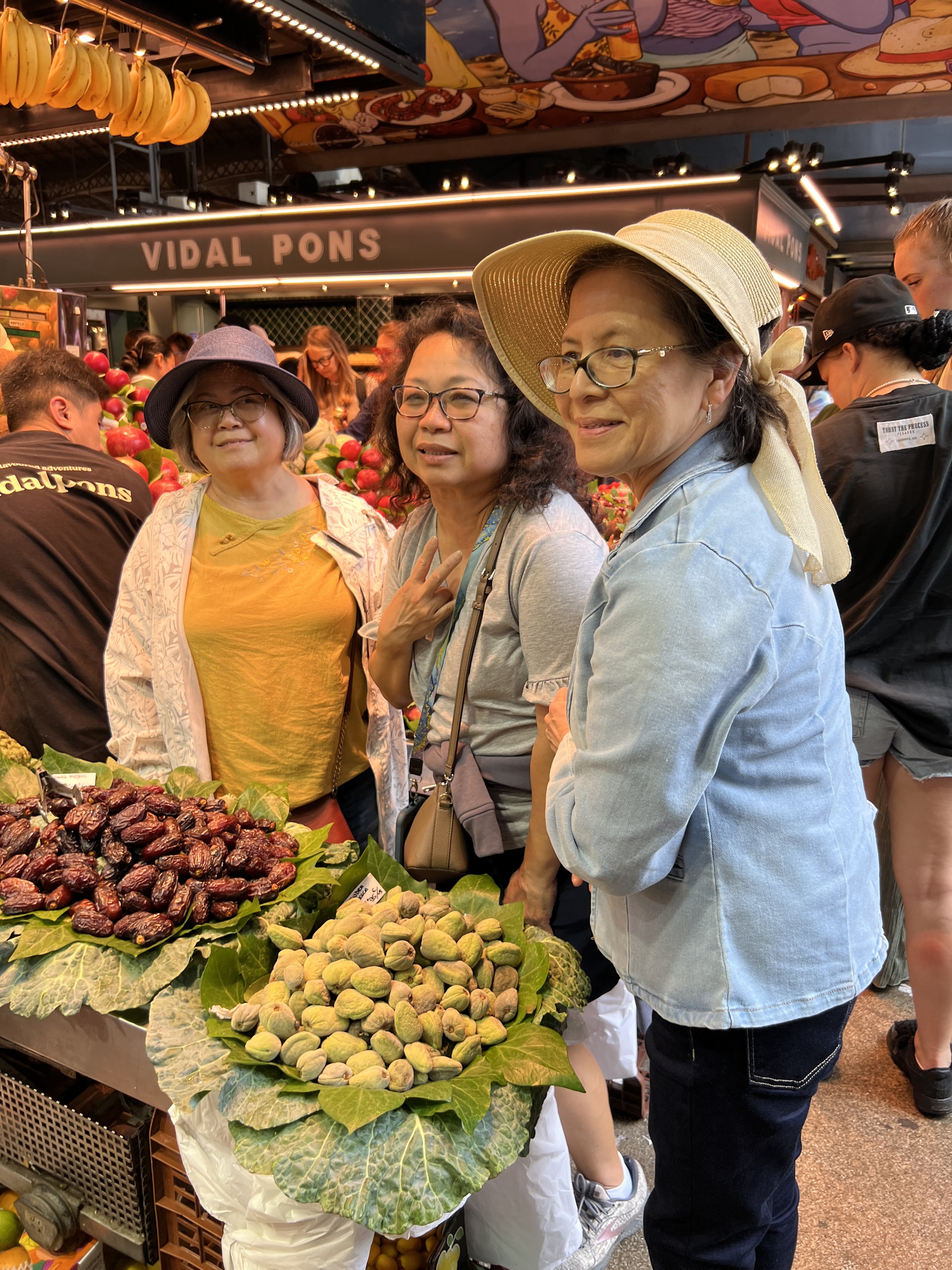 A group of women standing in a market