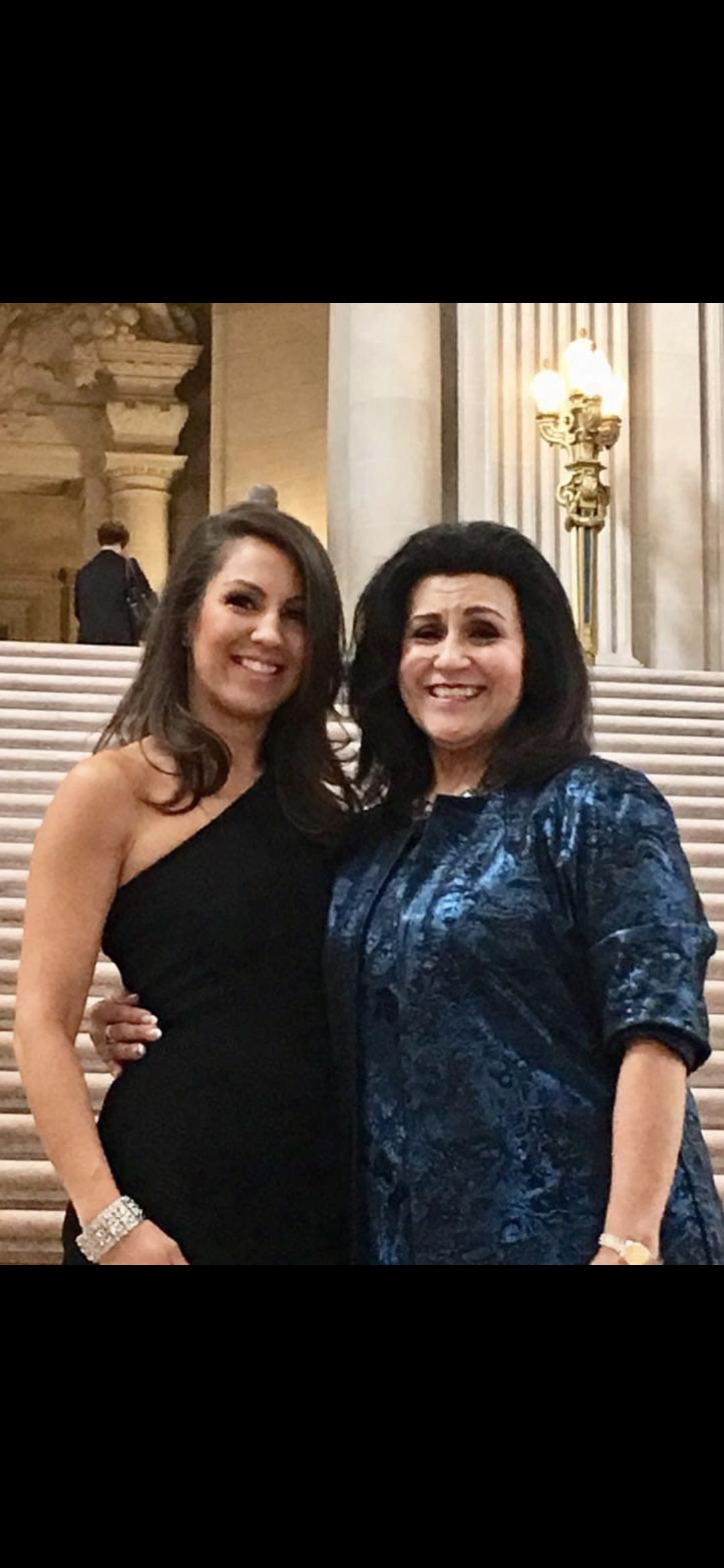 Two women standing together smiling