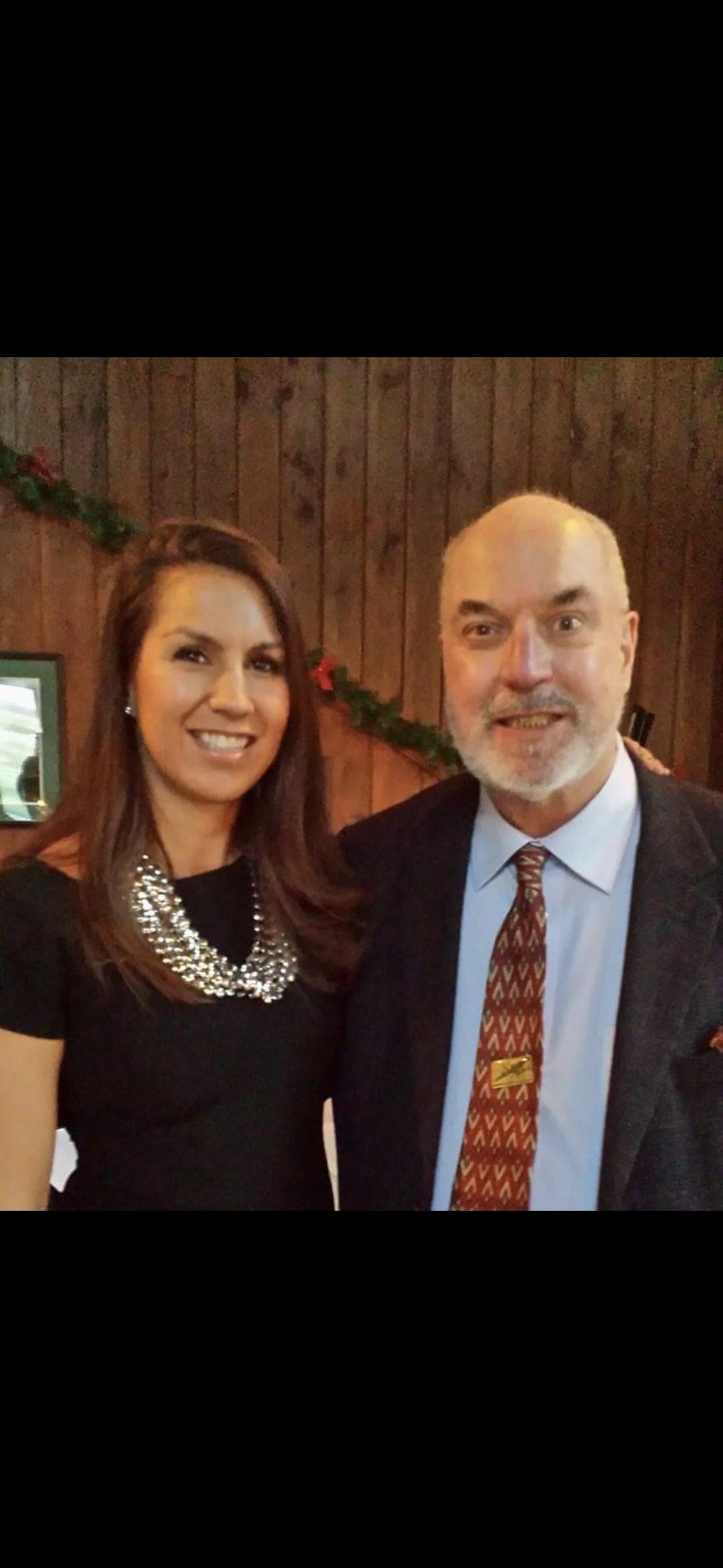 A man and woman posing for a picture
