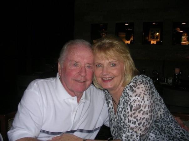 A man and woman posing for a picture