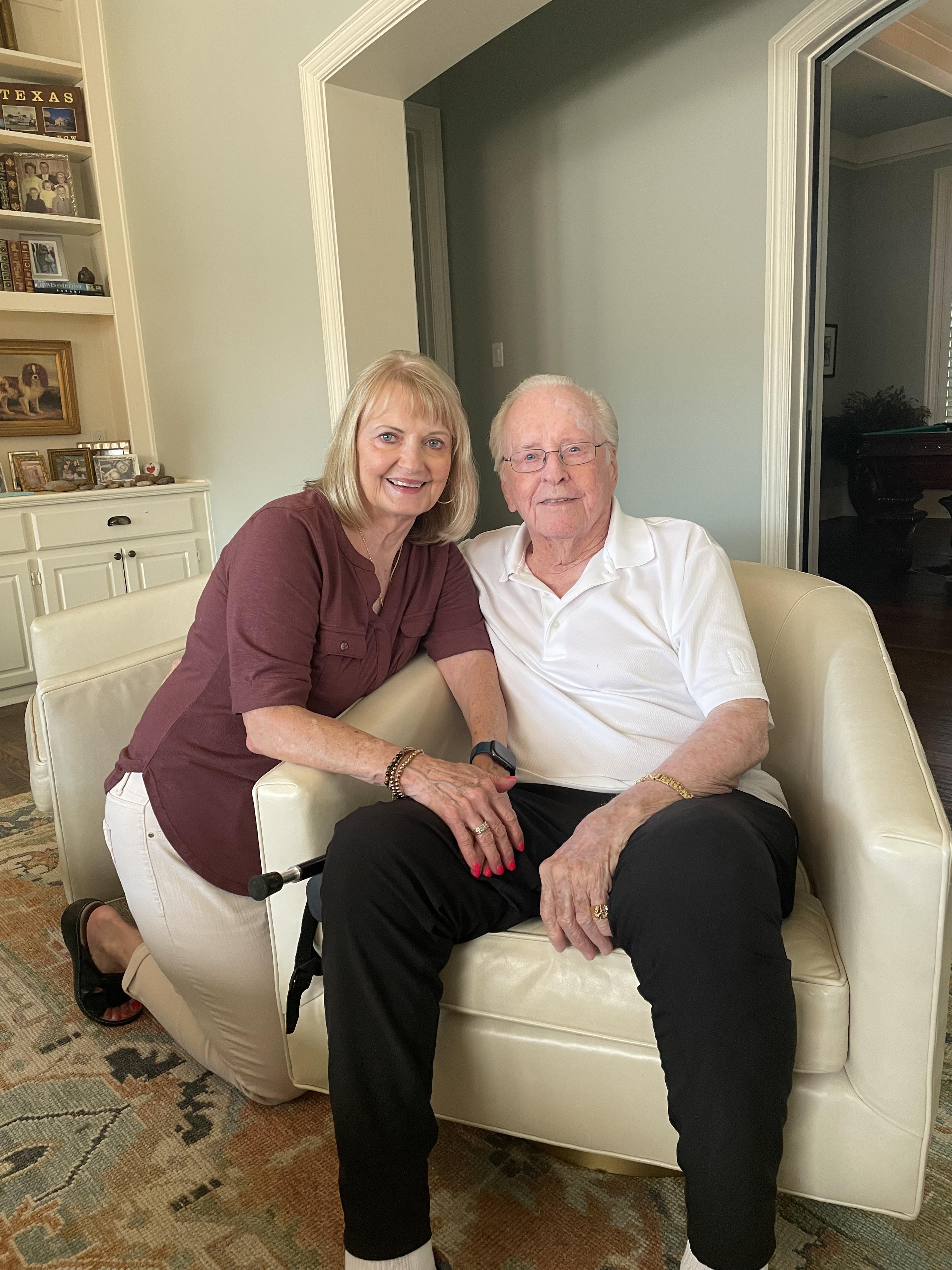 A man and woman sitting on a couch