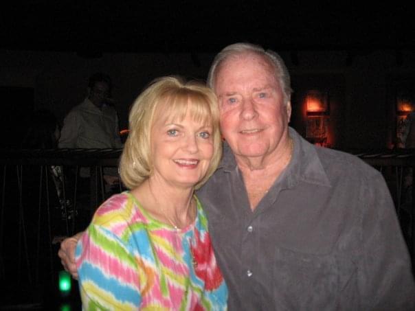 A man and woman posing for a picture