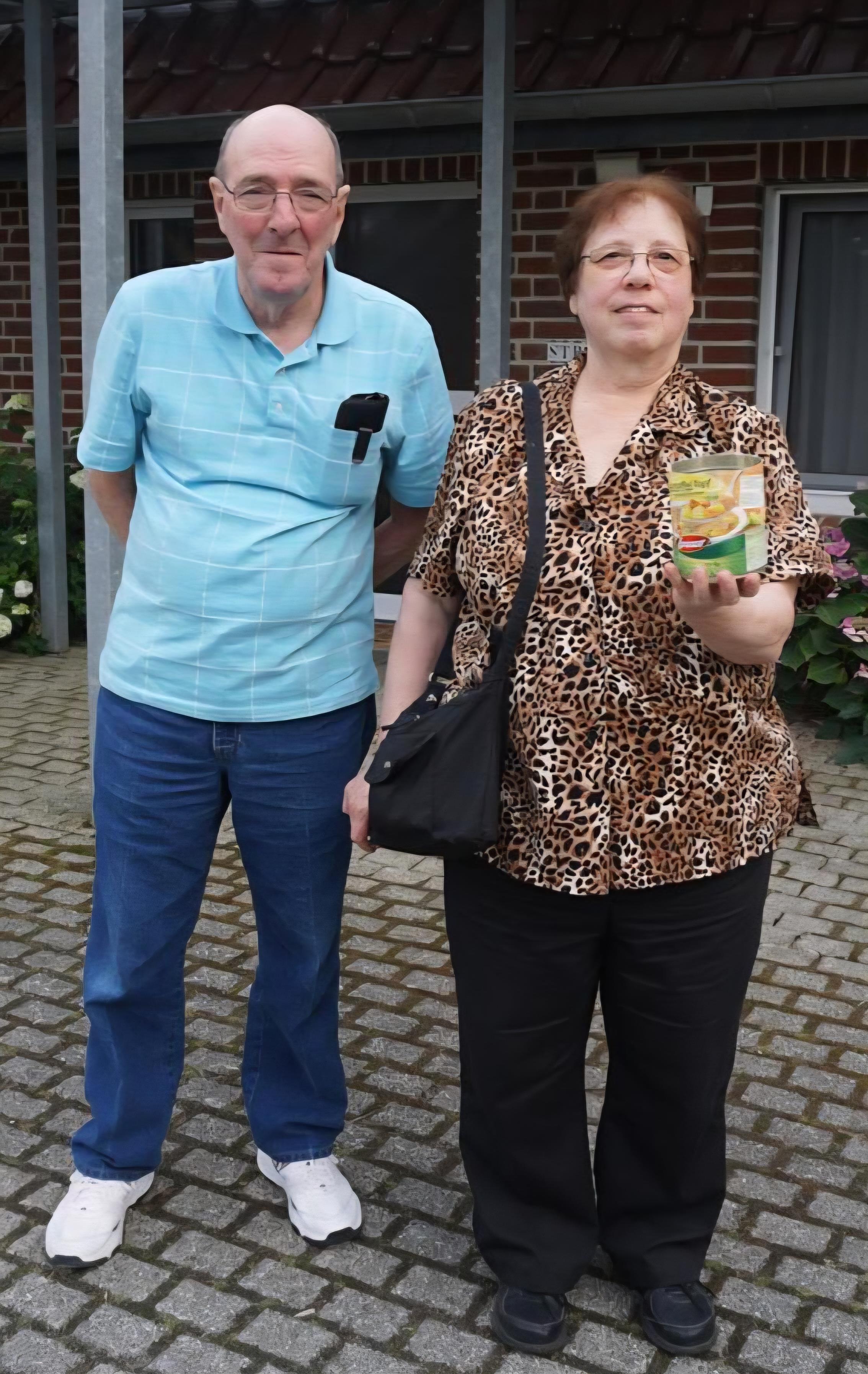 A man and woman standing next to each other