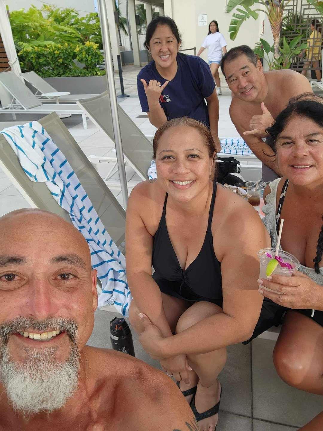 A group of people posing for a selfie