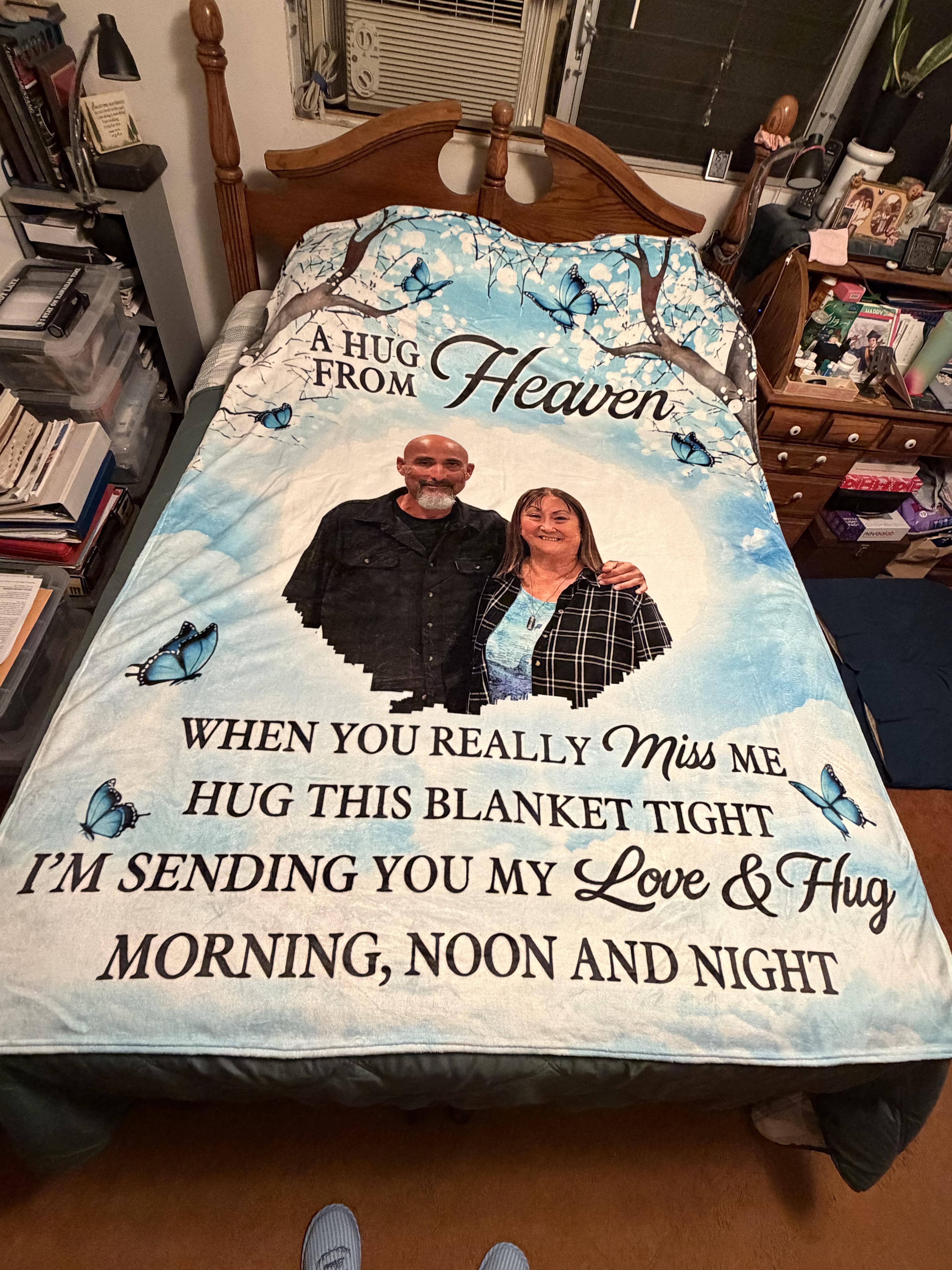 A bed with a picture of a man and woman