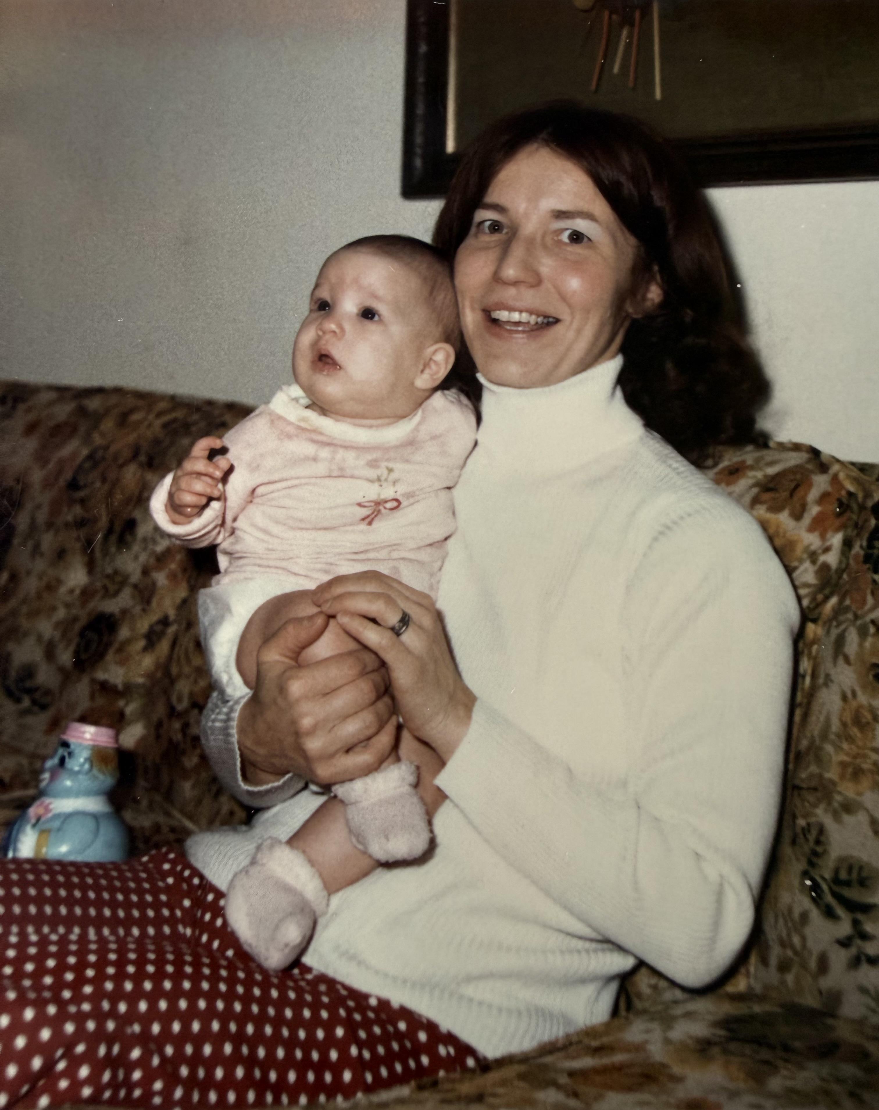 A woman holding a baby