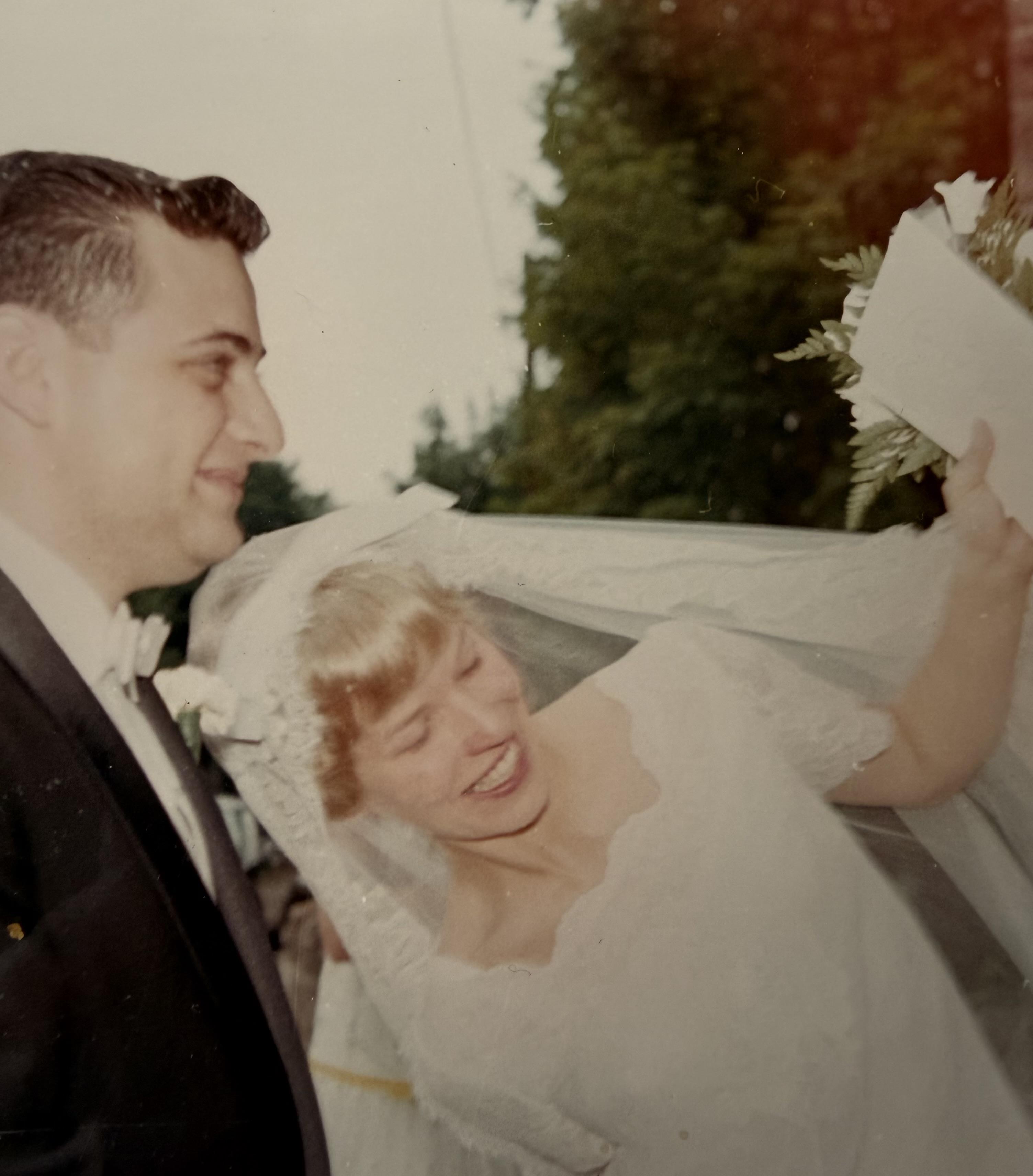 A man and woman in wedding attire