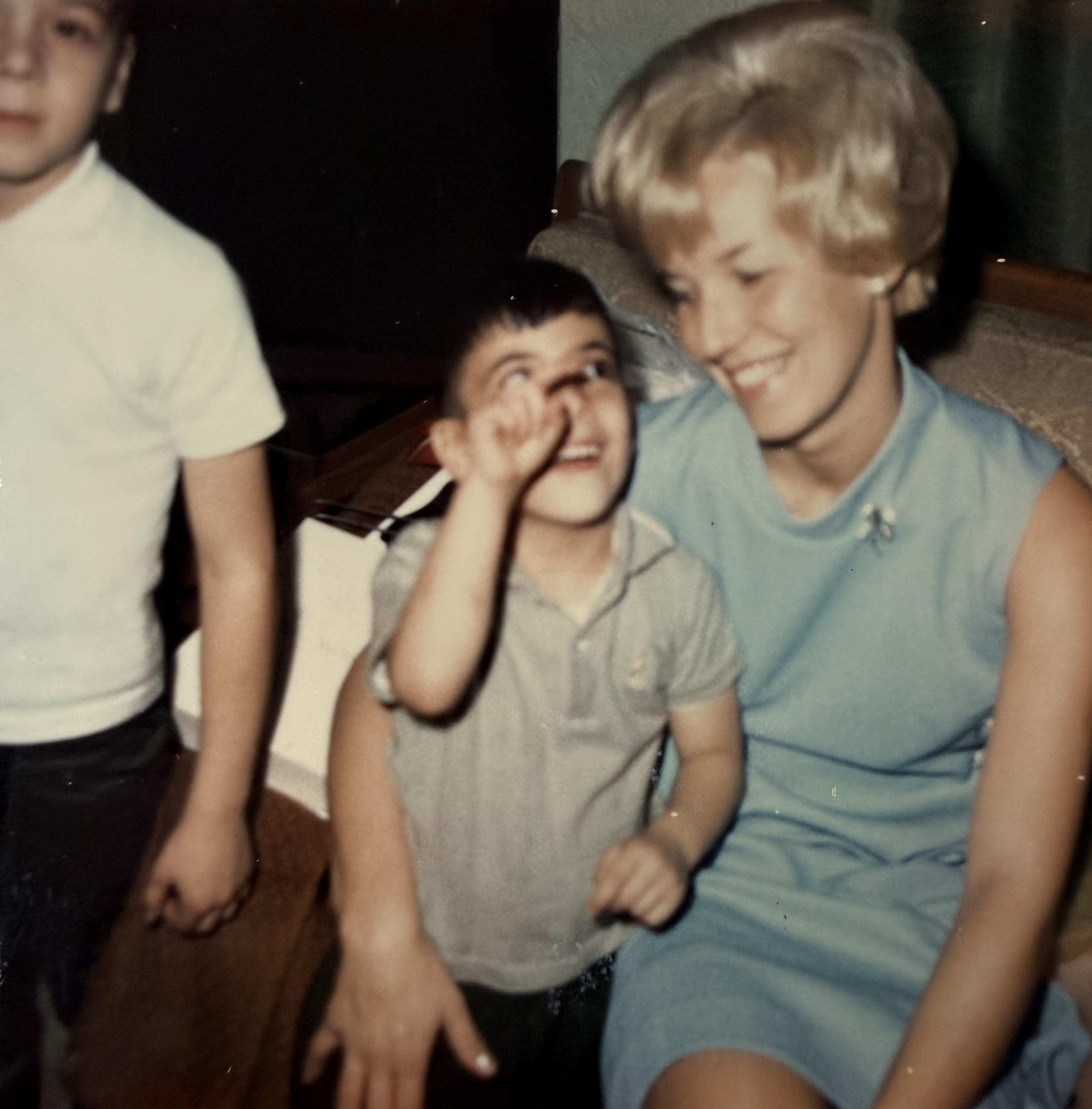 A woman and a boy sitting on a couch