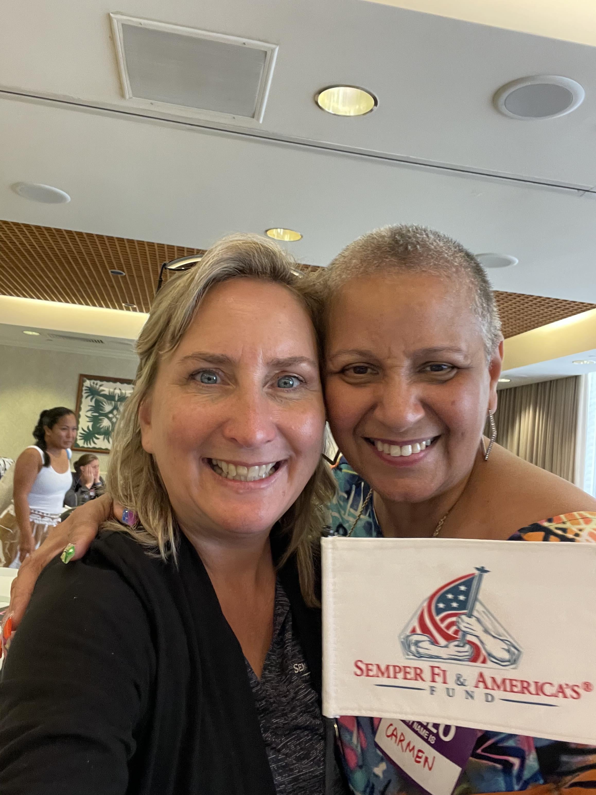 Two women smiling at the camera