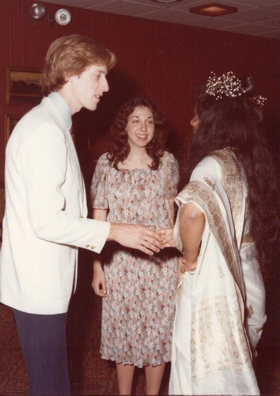 A man and woman standing next to each other