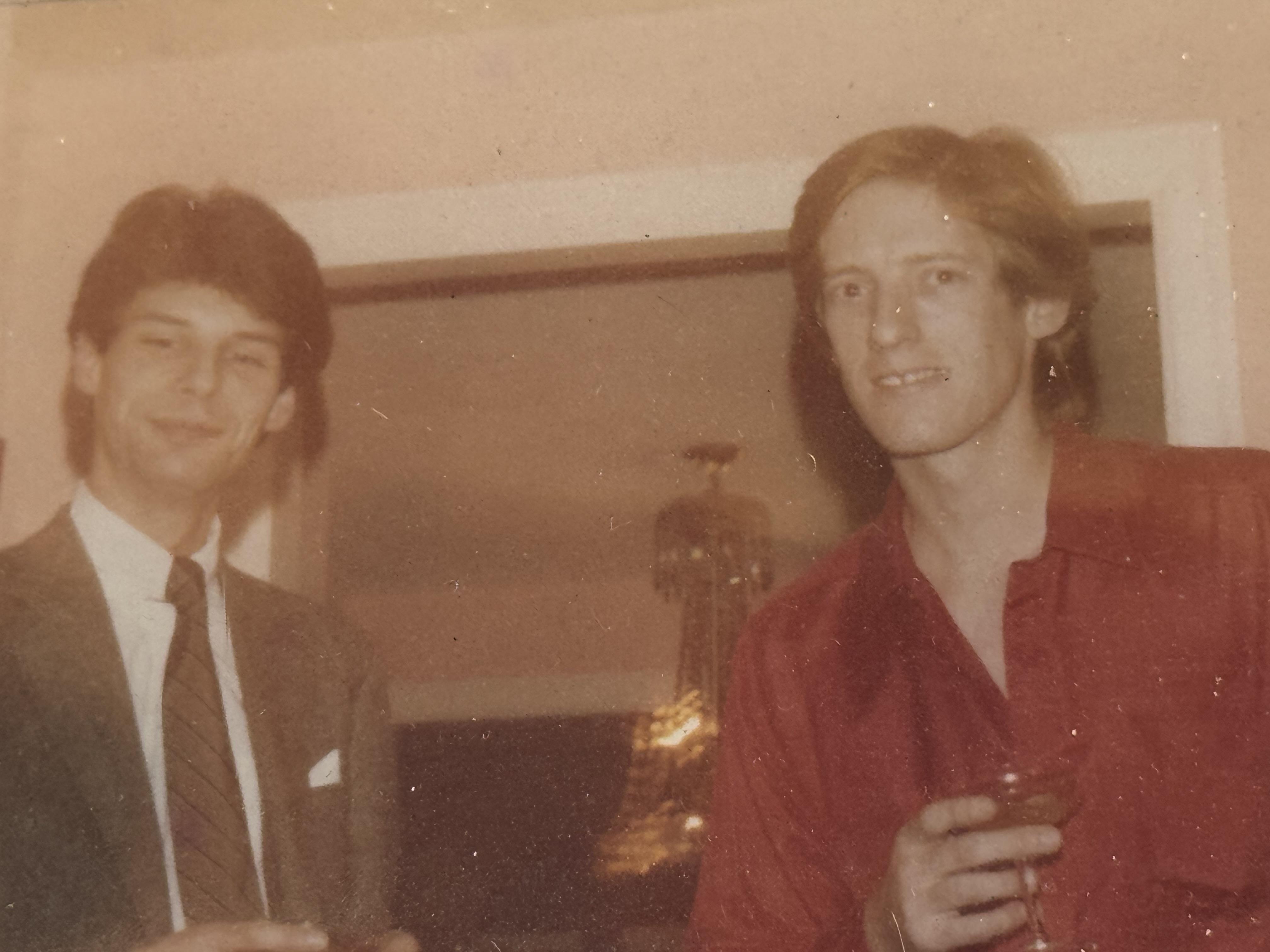 A couple of men posing for a picture