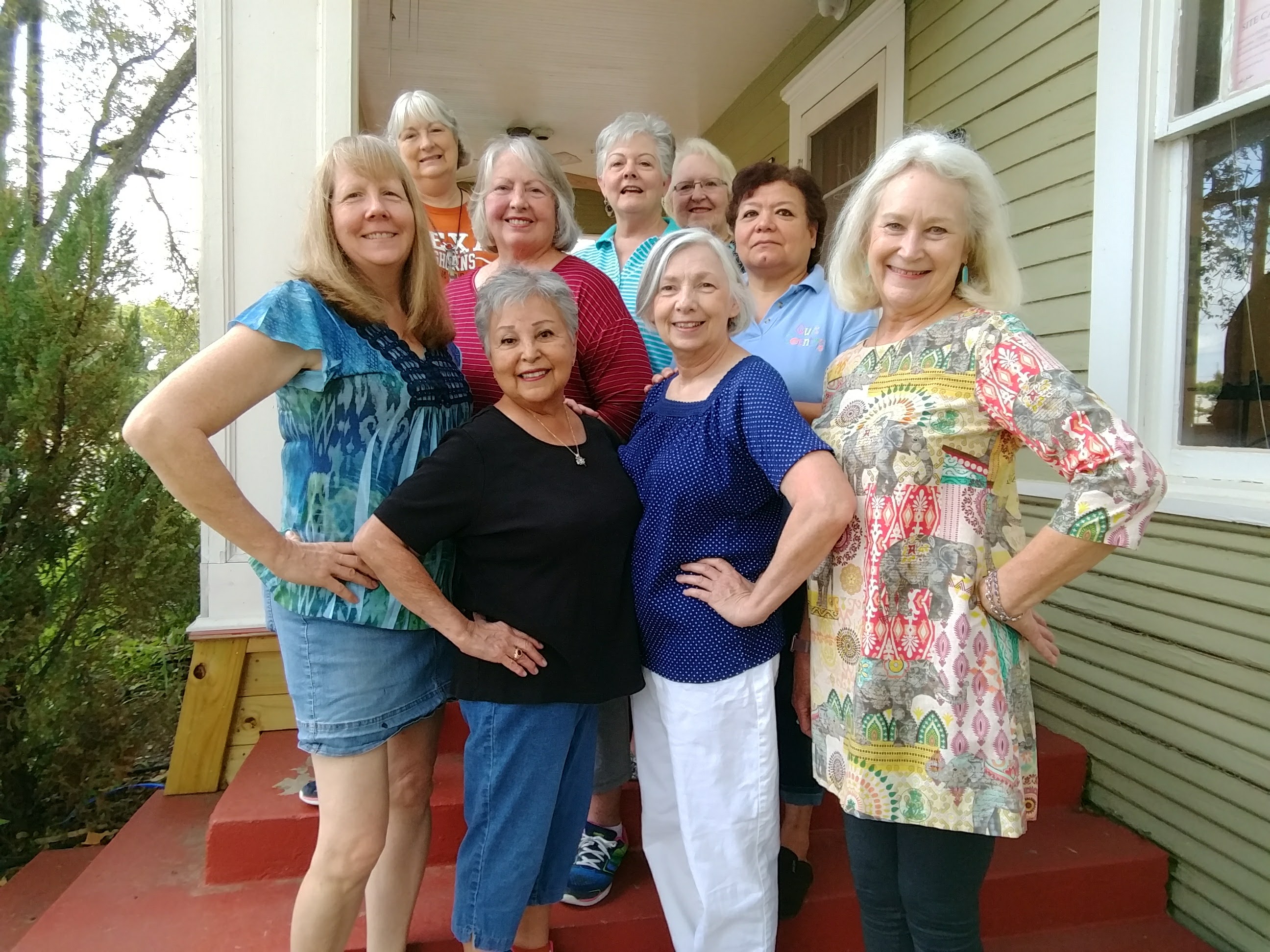 A group of women standing on steps