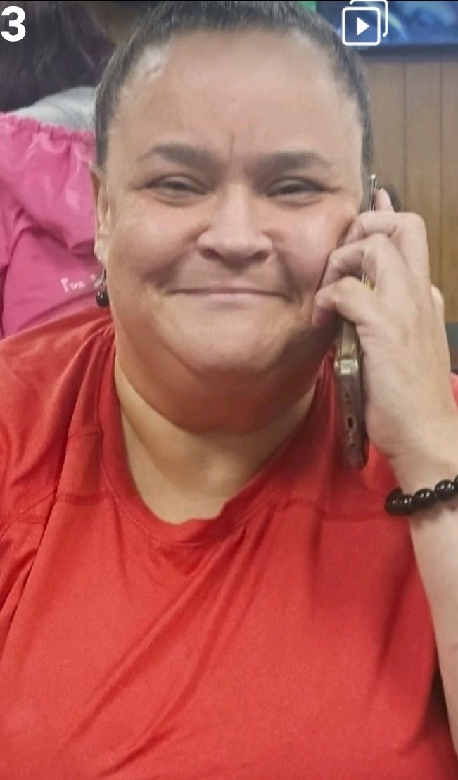 A woman holding a cell phone to her ear