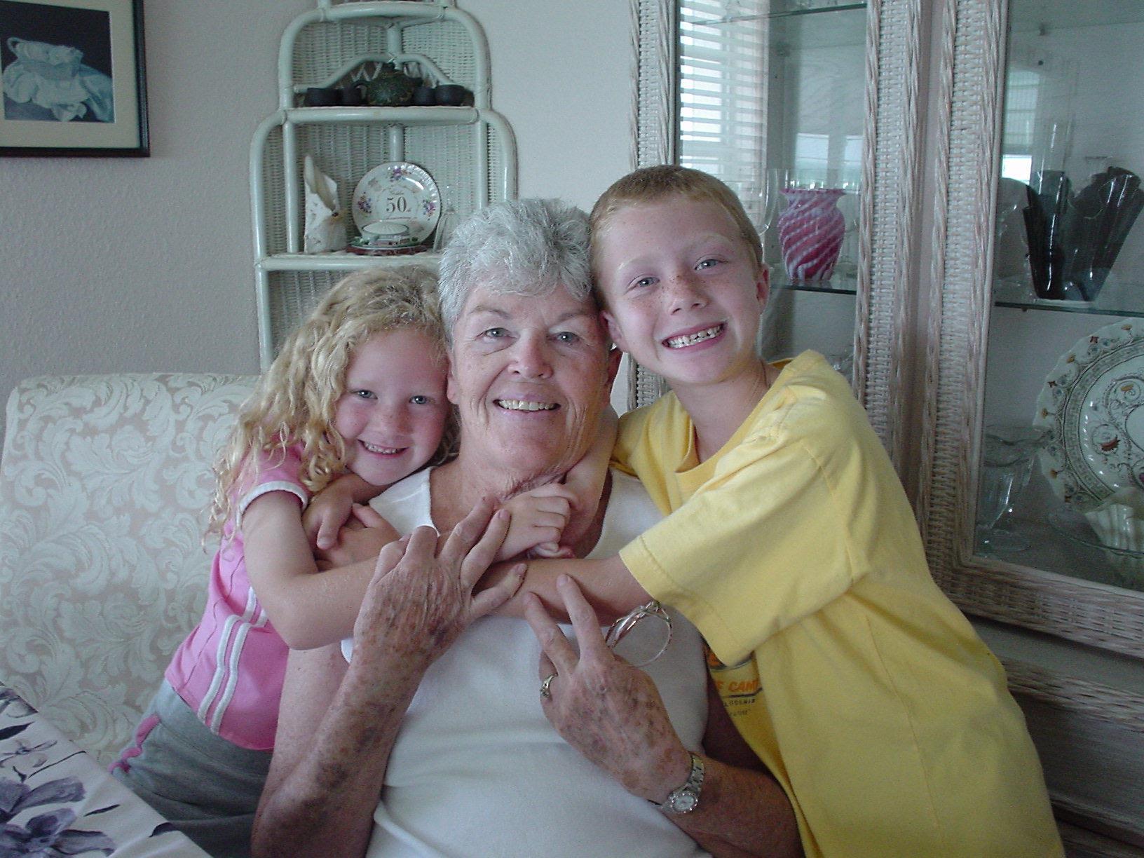 A woman and two girls posing for a picture