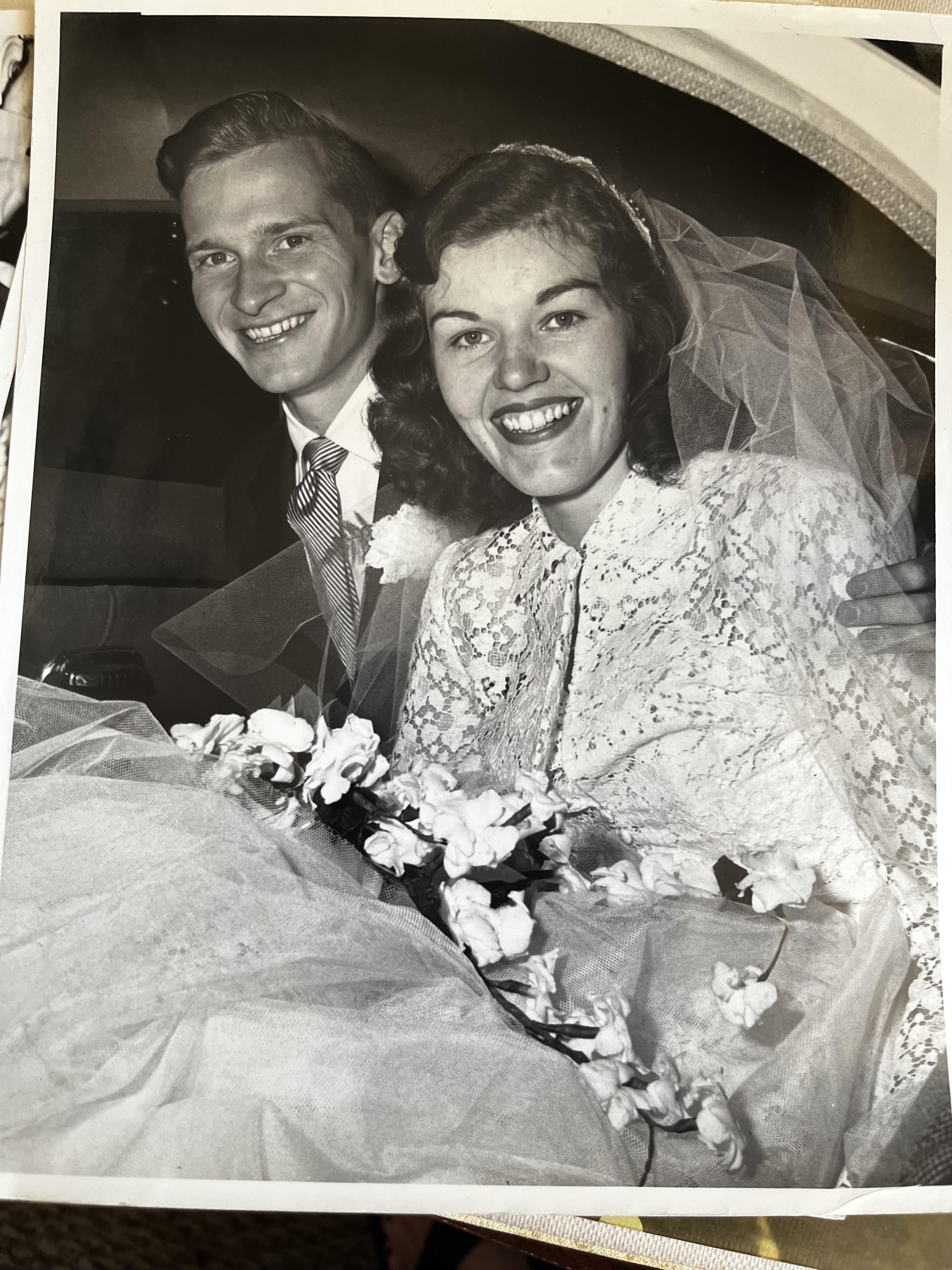 A man and woman in wedding attire