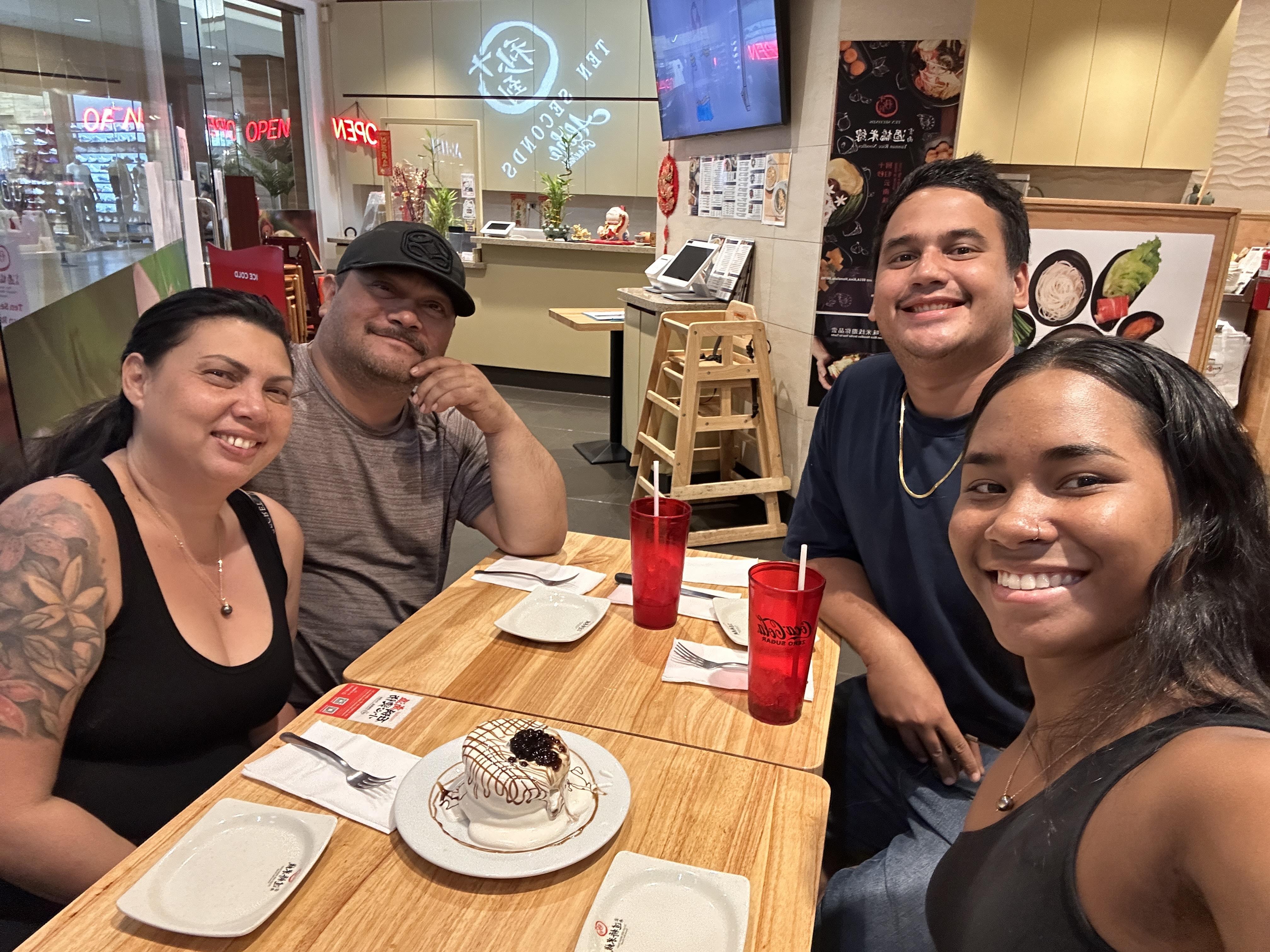 A group of people sitting at a table
