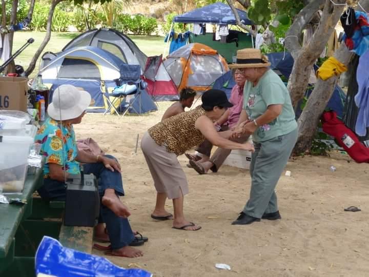 A group of people outside in a tent