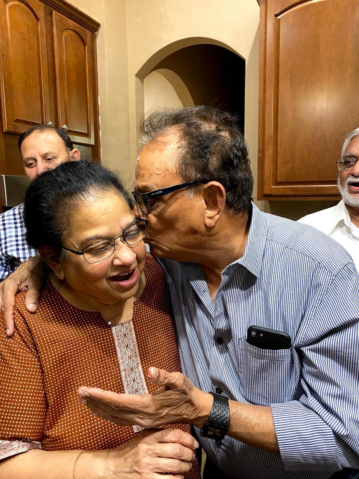 A man kissing a woman