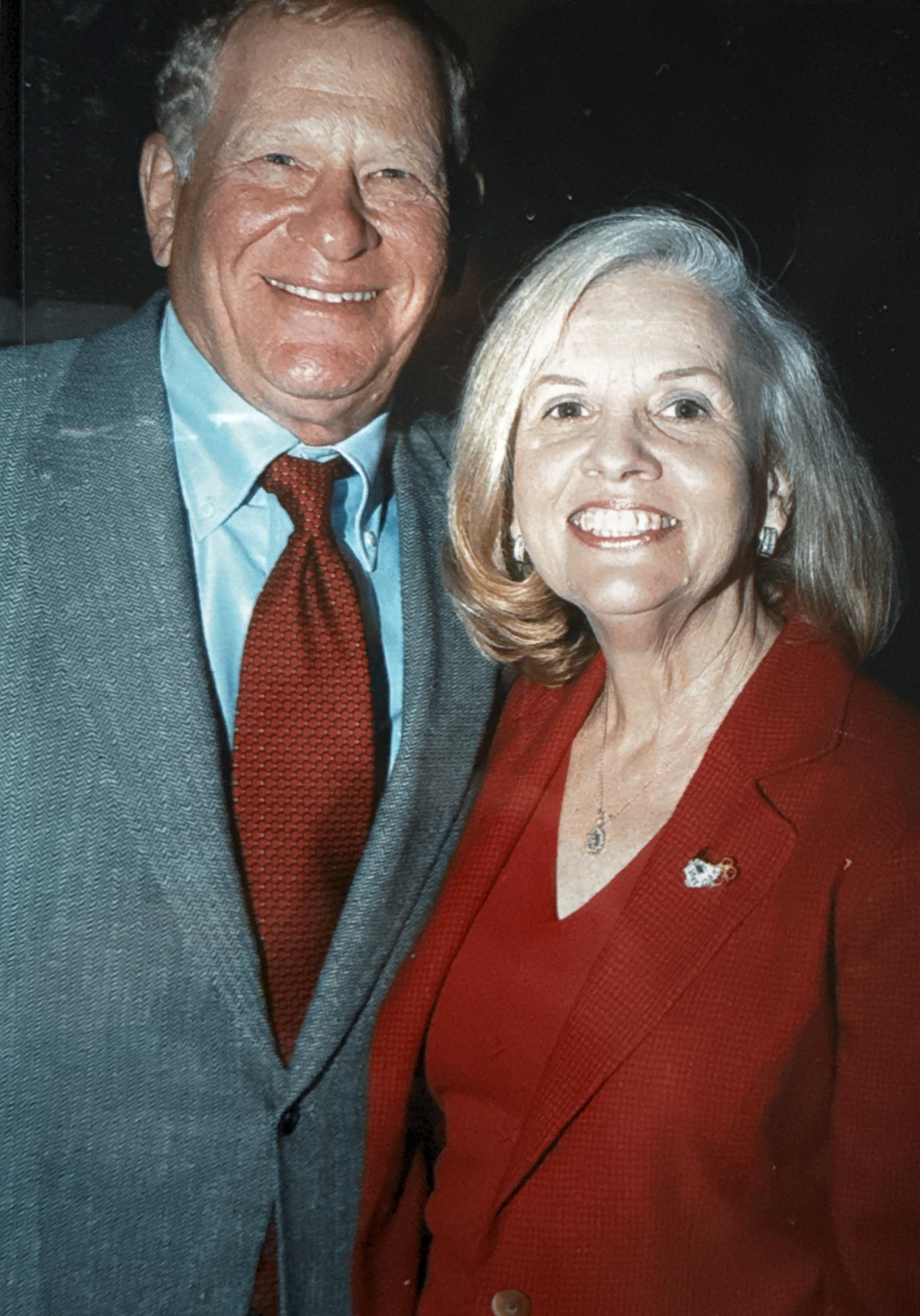 A man and woman smiling at camera