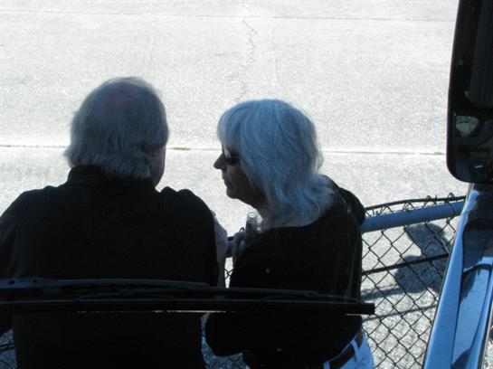 A man and woman sitting on a bench