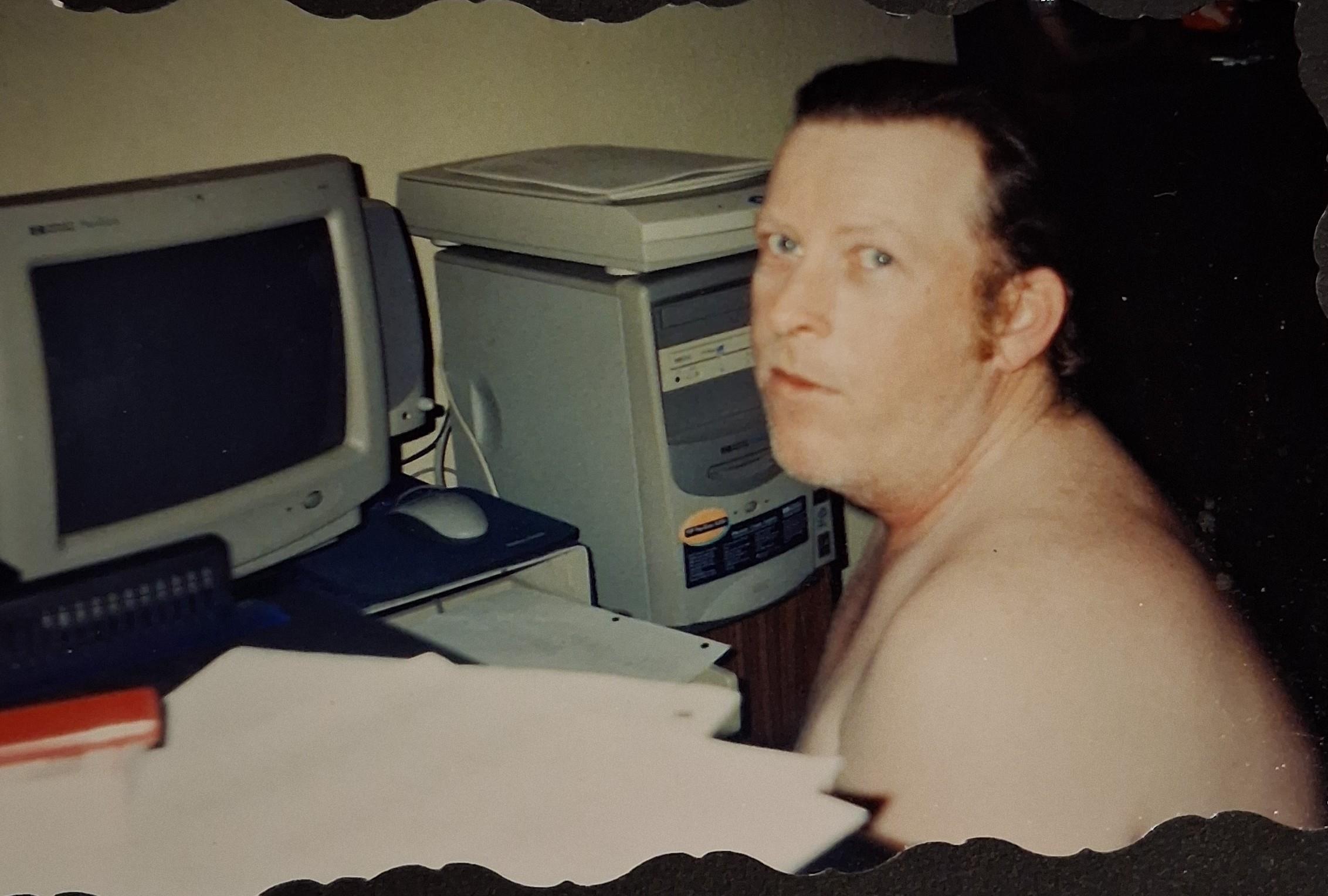 A man sitting in front of a computer
