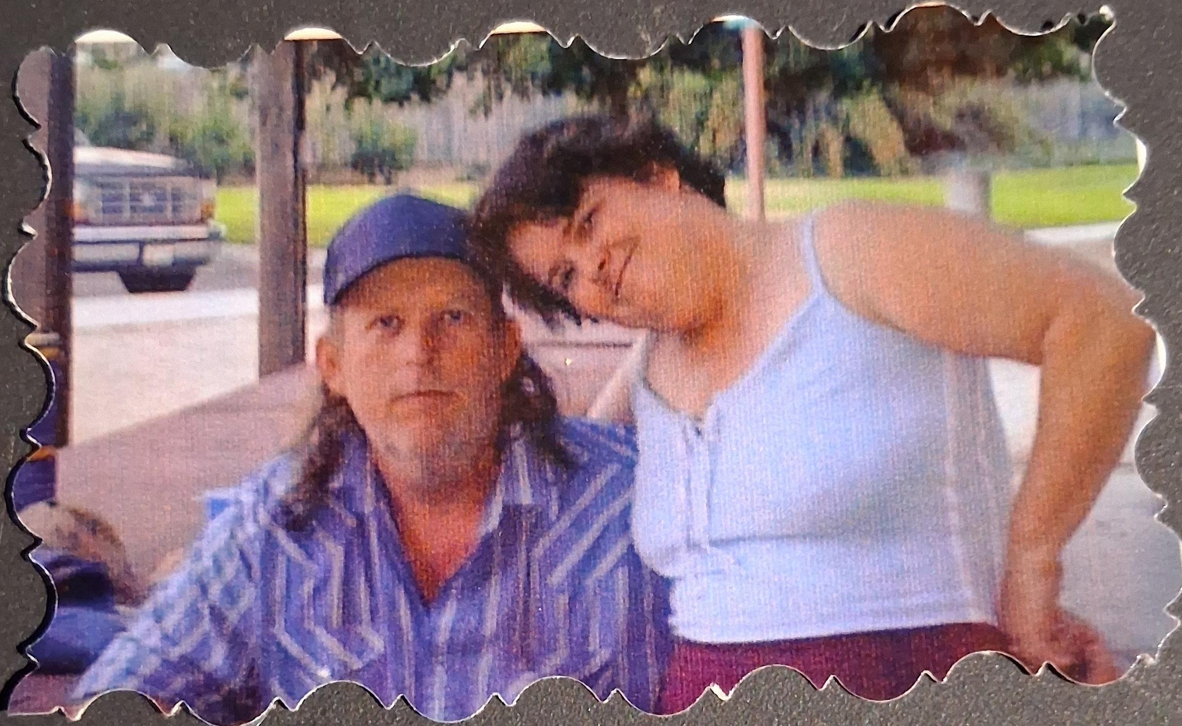 A man and woman posing for a picture