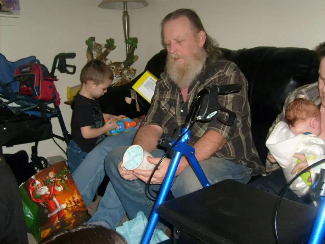 A man sitting on a couch with a child