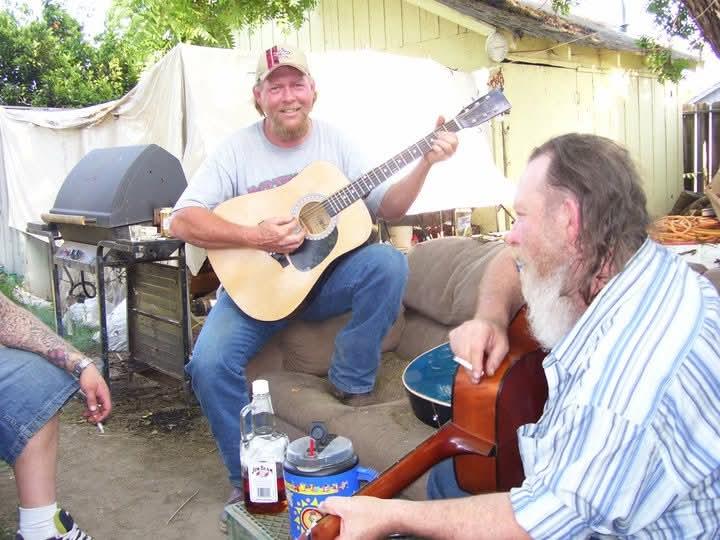 A group of men playing guitars