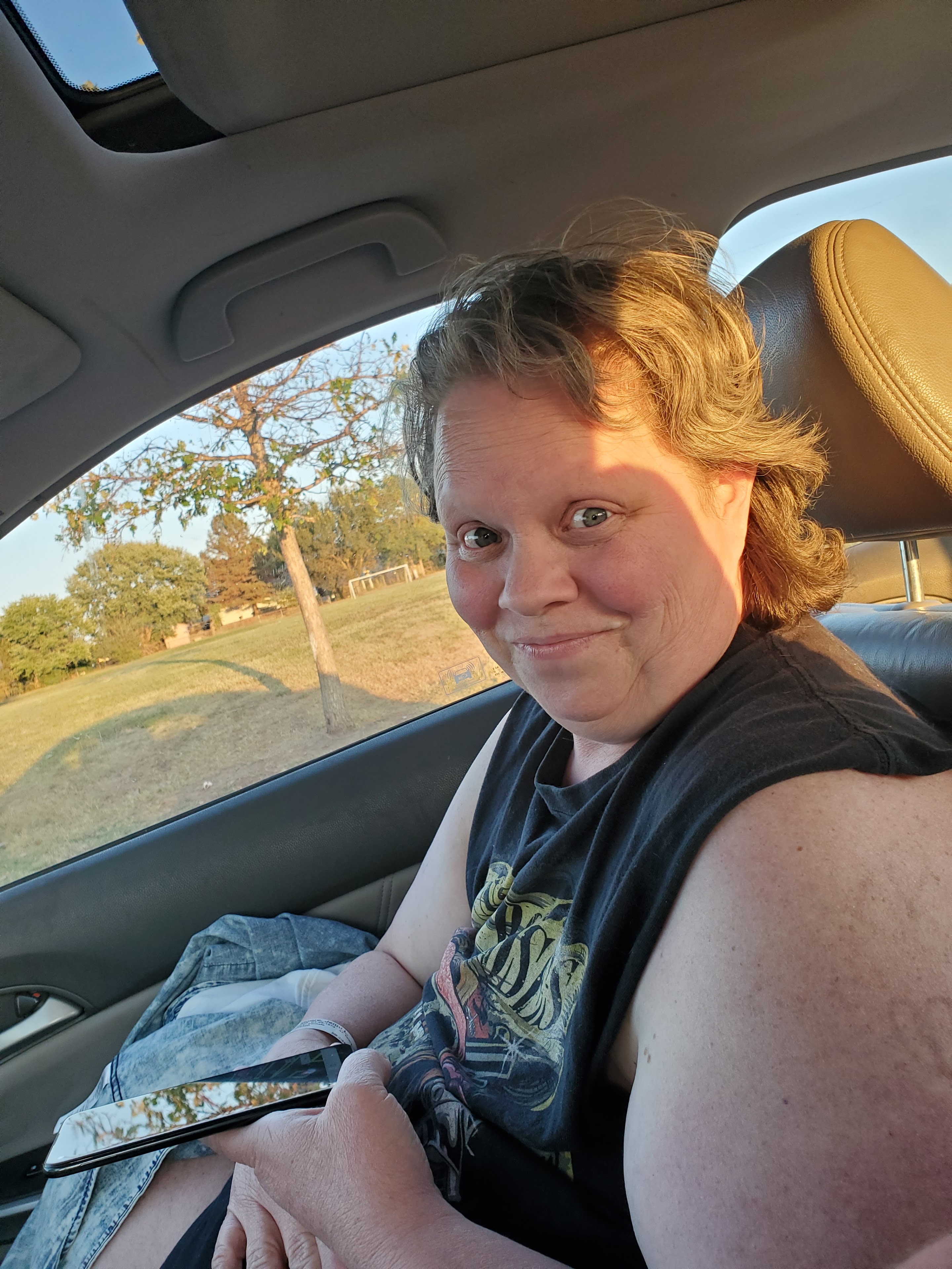 A woman sitting in a car
