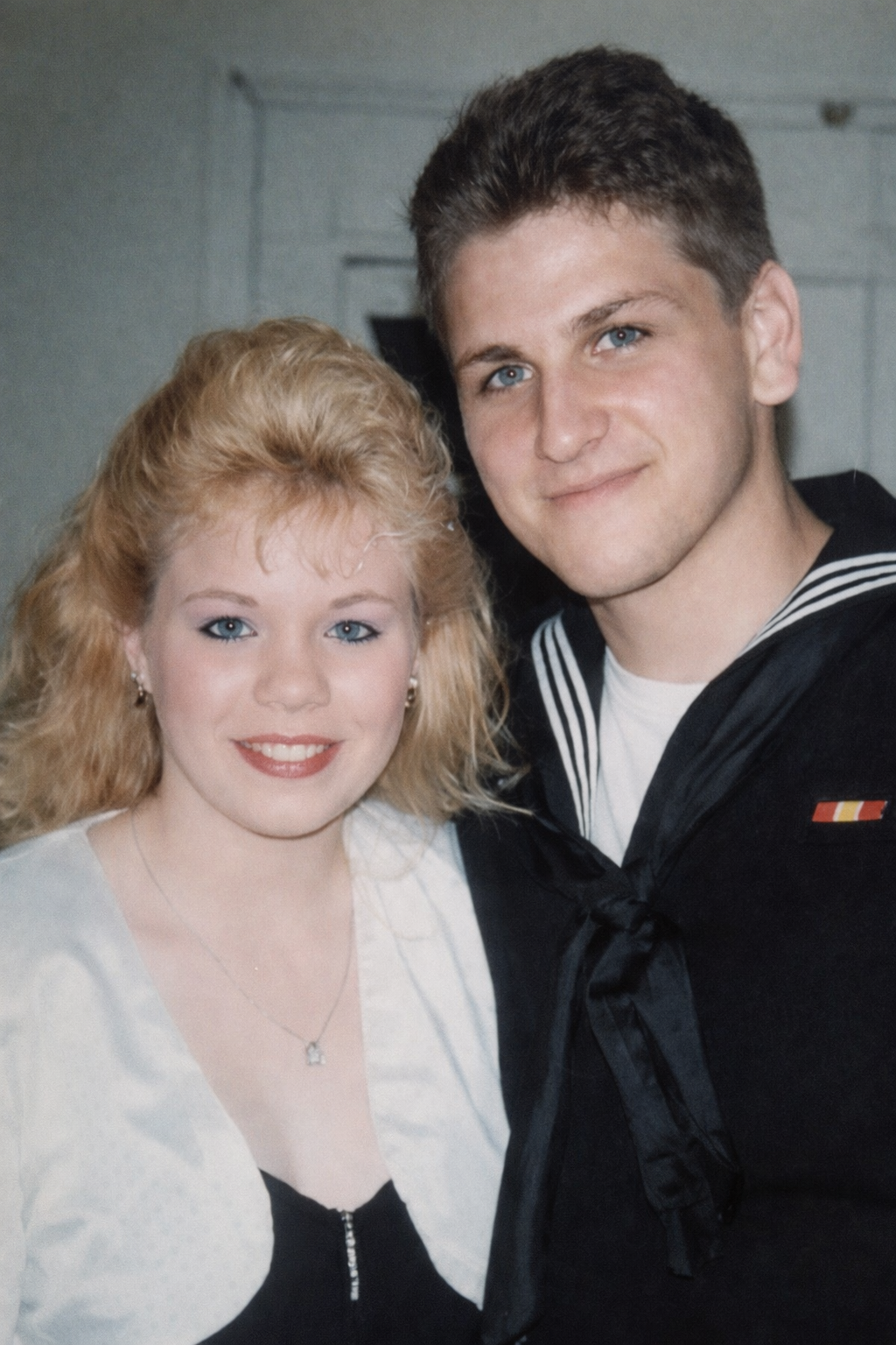 A man and woman posing for a picture