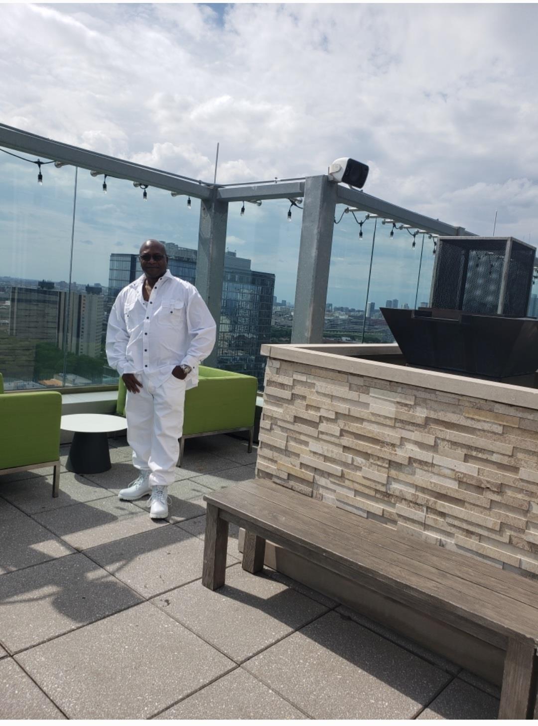 A man standing on a rooftop