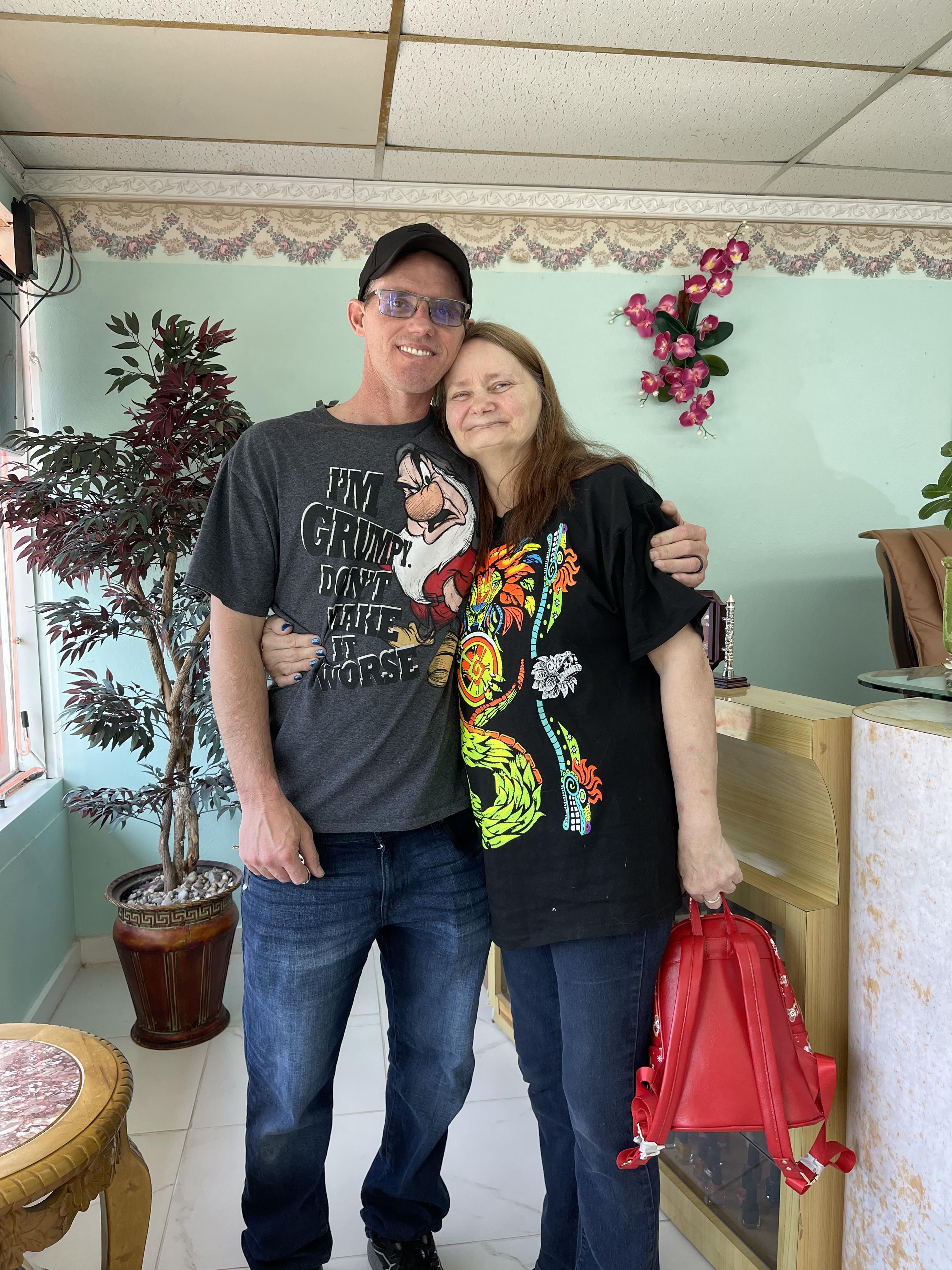 A man and woman posing for a picture