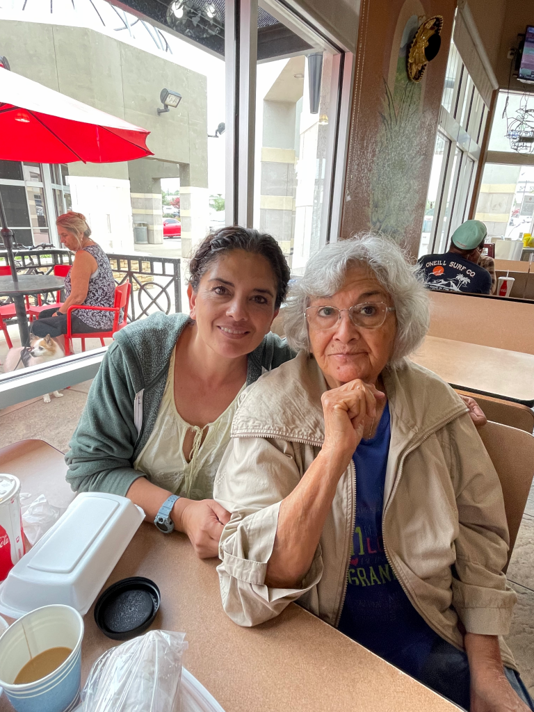 A woman sitting next to a woman