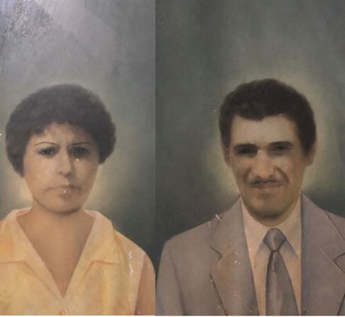 A man and woman posing for a picture