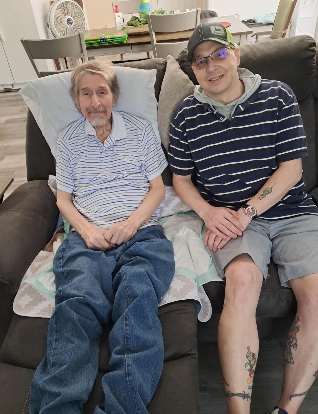 Two men sitting on a couch